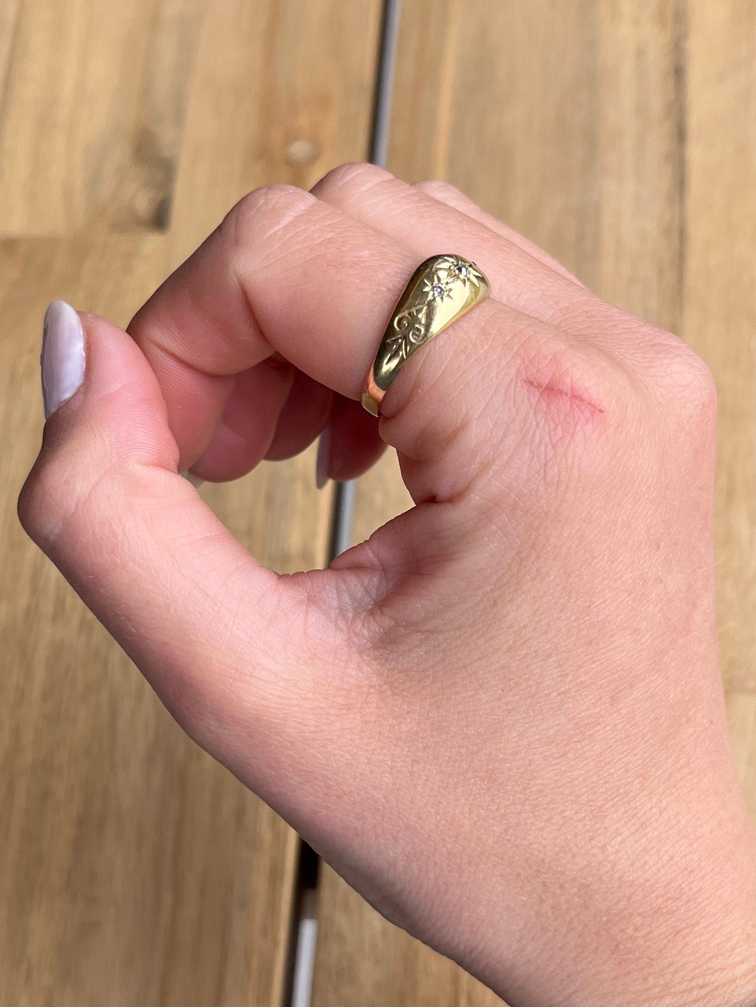 This gorgeous 18ct gold band holds three diamonds totalling 10pts. They are bright and have a lovely sparkle and are set in star settings. Hallmarked Birmingham 1915..

Ring Size: P 1/2 or 8 
Band Width: 8mm 

Weight: 2.8g