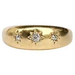 Art Deco Diamond and 18 Carat Gold Three-Stone Star Setting Band