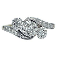Art Deco Diamond and 18 Carat Gold Three-Stone Twist Ring