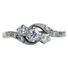 Art Deco Diamond and 18 Carat Gold Three-Stone Twist Ring