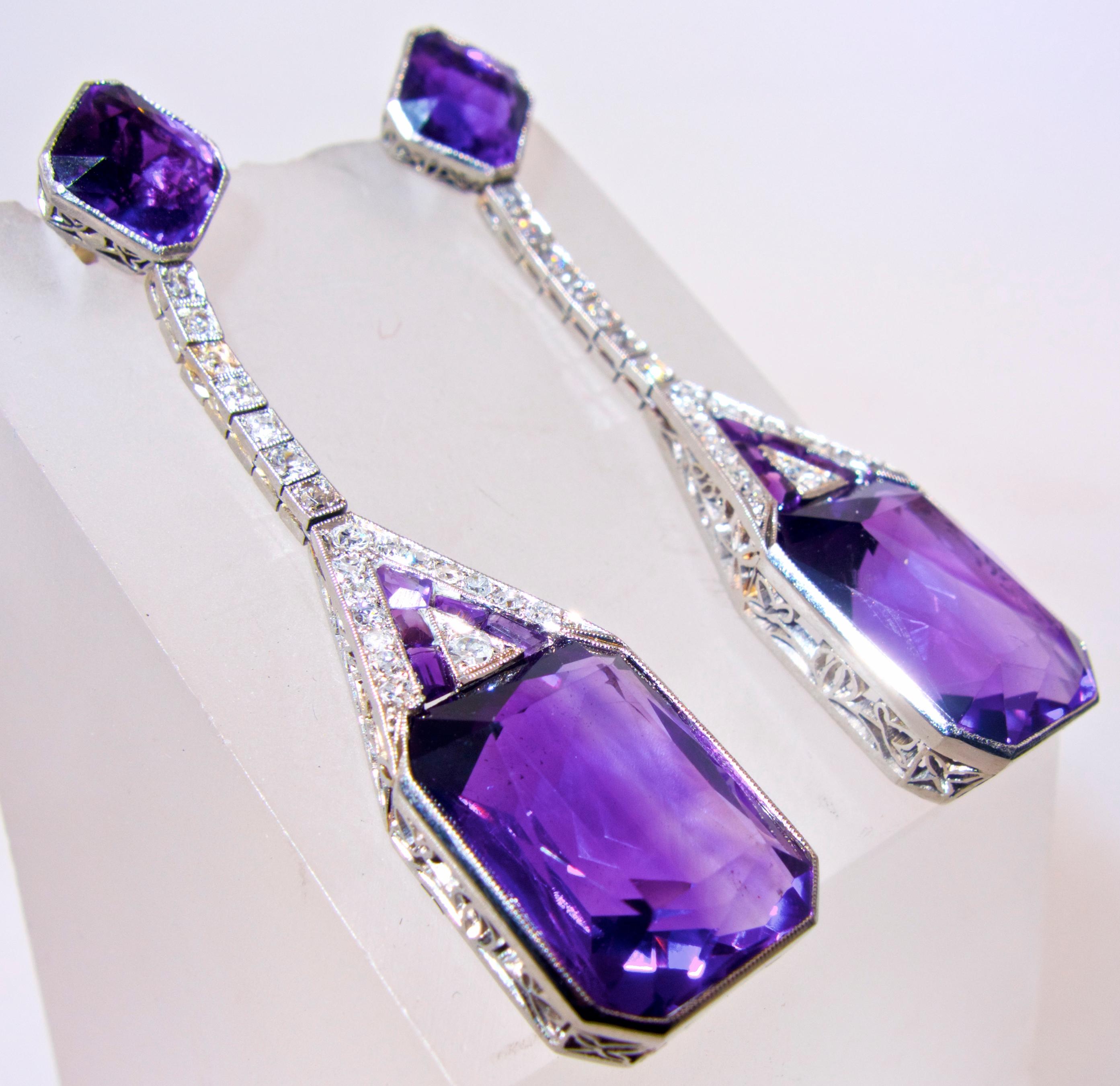 Platinum Art Deco Diamond and Amethyst earrings - long pendant style with rectangular cut fine matching bright purple natural amethysts and emerald cut amethysts and calibre cut amethysts.  The 42 round old cut diamonds are bead set, all of the