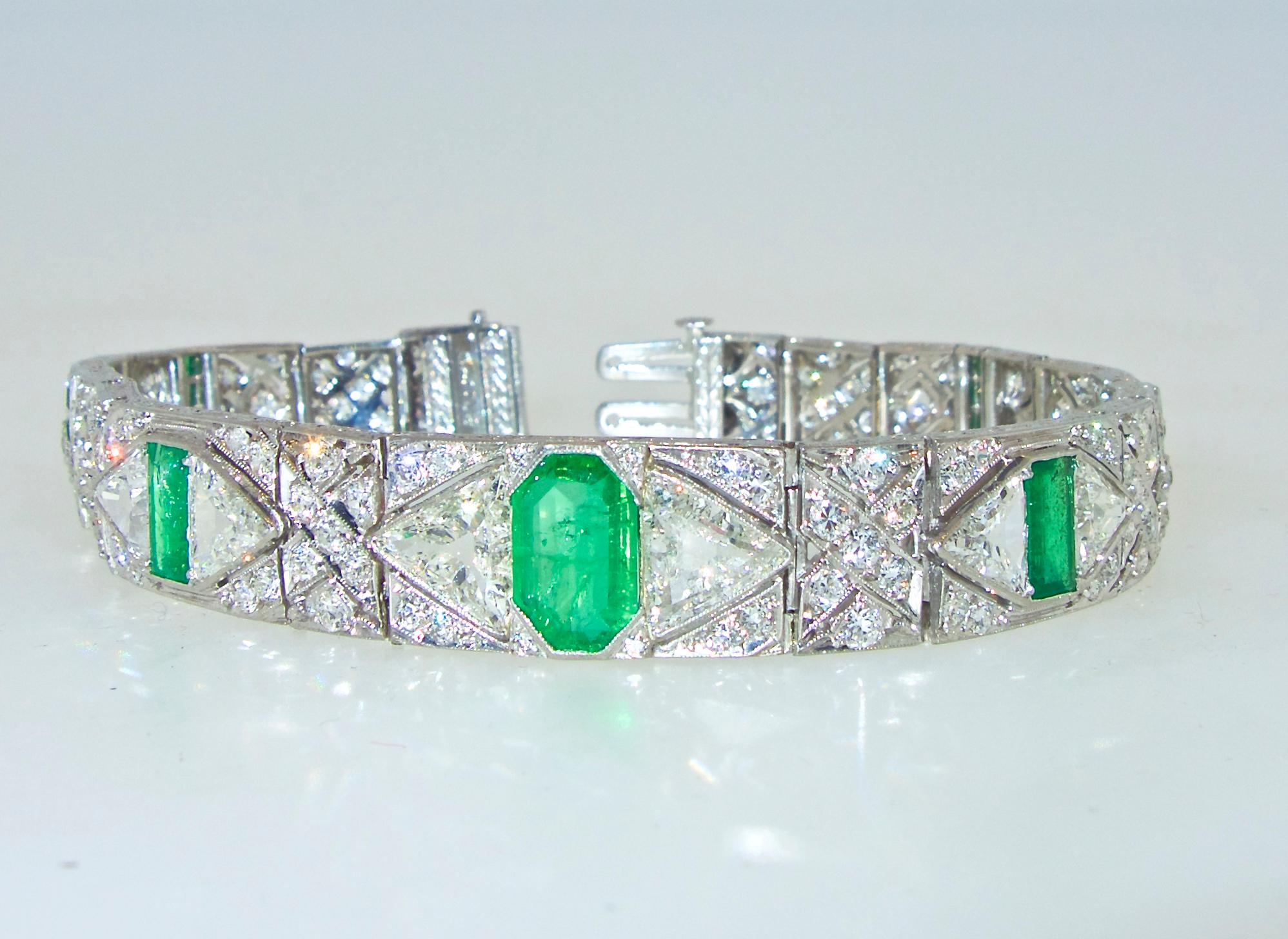 Striking Art Deco design with fine emeralds andlarge fancy cut diamonds.  The total diamond weight is approximately 11.3 cts.,   The diamonds are both European cut and large triangle cuts.  These triangular cuts are unusual and hard to find.  They