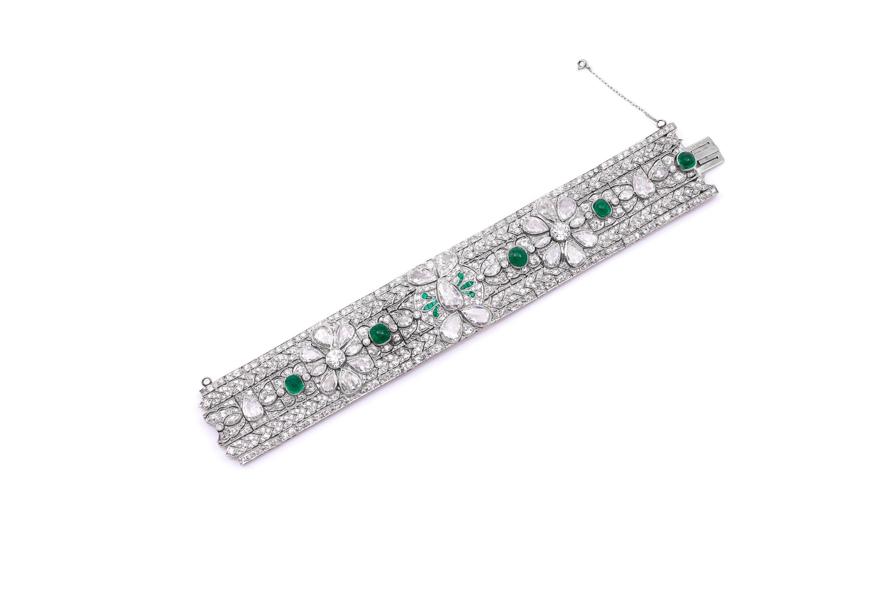 Finely crafted in platinum with Pear Shaped diamonds weighing approximately a total of 22.50 carats, Round and Marquise cut diamonds weighing a total of approximately 25.00 carats, and Cabochon Emeralds weighing approximately a total of 8.00