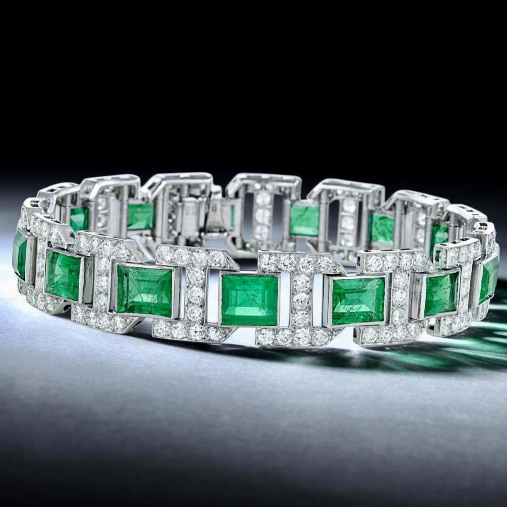 A very fine Art Deco Emerald bracelet, Crafted in Platinum Colombian Emerald; set with emerald-cut emeralds, weighing a total of approximately 18 carats; accented with round-cut diamonds, weighing a total of approximately 7.40carats, most with I-J