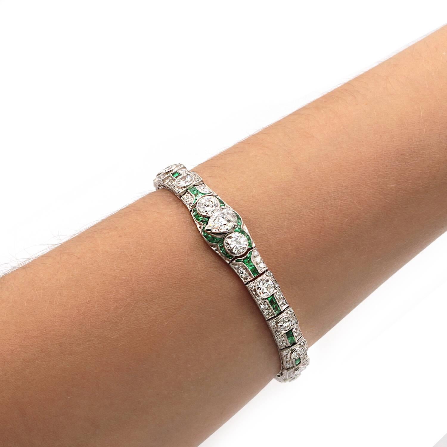  A fabulous art deco diamond and emerald bracelet . Center diamond a GIA pear shape F in color and VS 2 in clarity. The bracelet consist of approximately another 8 carats of old mine diamonds. 