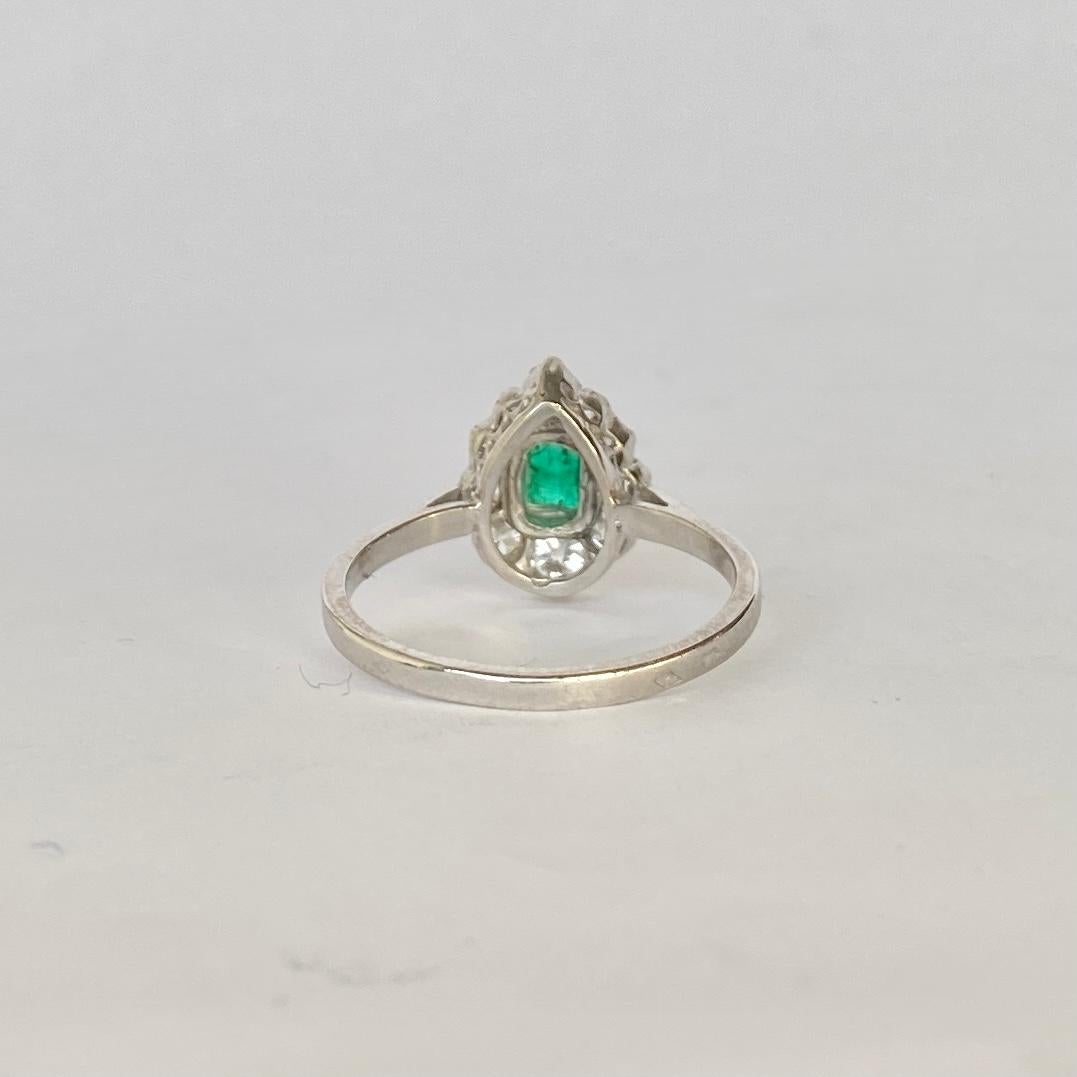 This stunning pear shaped ring holds a diamond total of 90pts and the emerald at the centre measures 15pts. The diamonds are old mine cut and are bright and very sparkly. Modelled in platinum. 

Ring Size: O or 7 1/4 
Top to Bottom: 12.5mm
Height