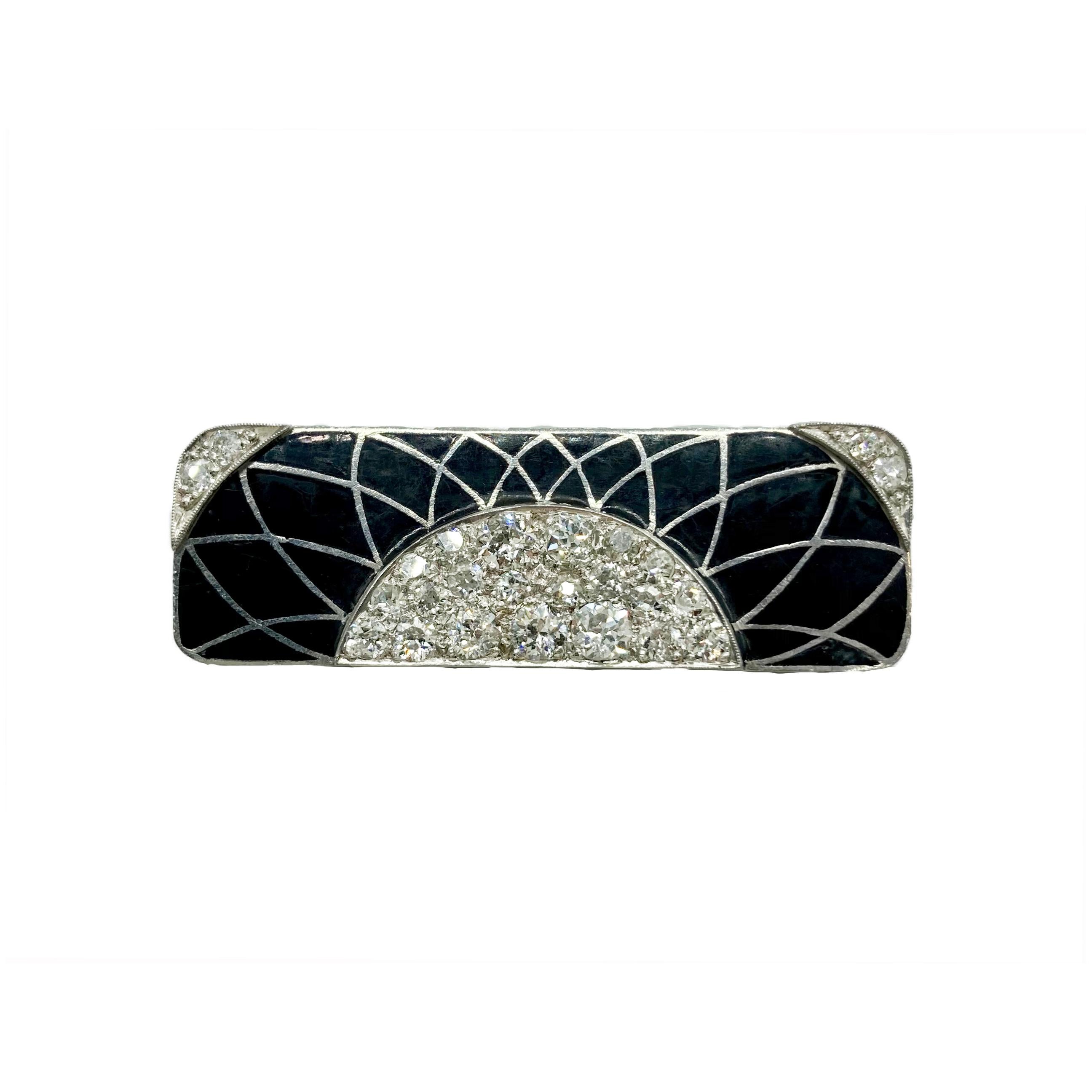 An elegant Art Deco diamond and enamel white gold brooch of geometric design. Circa 1920s.