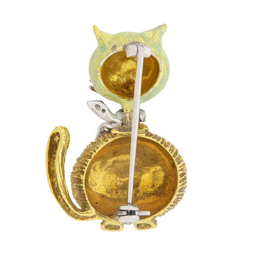 This art deco style cat brooch is full of character! The face is beautifully highlighted with multicoloured enamelling, a painstaking process.  The platinum collar is set with 0.15 carat of old cut diamonds, which have G colour and VS clarity