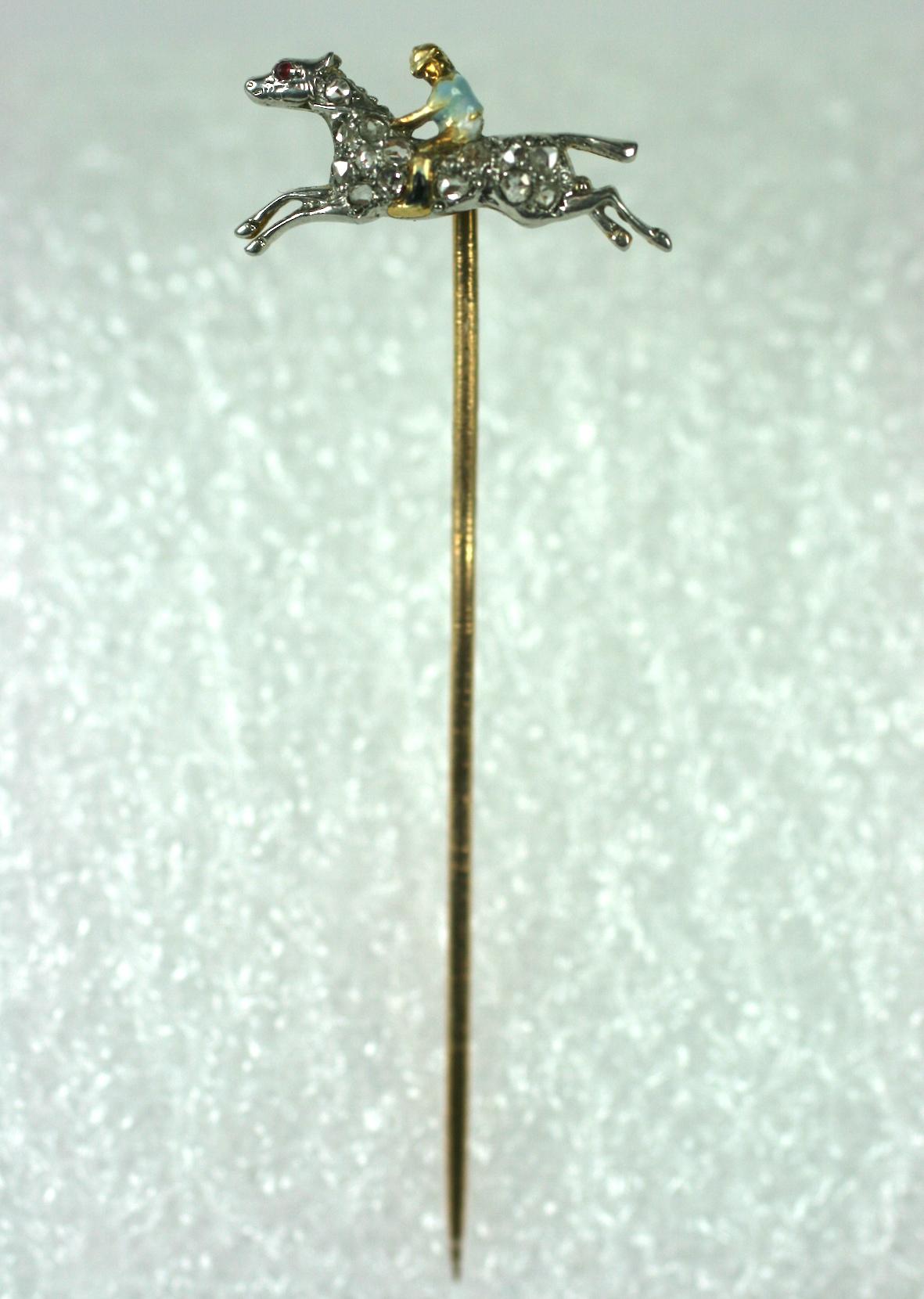 Diamond and Enamel Jockey Stickpin from the 1920's. Beautifully enameled jockey figure is set on a rose diamond pave horse in full stride. 14k gold with platinum top. 1920's USA.
2.5