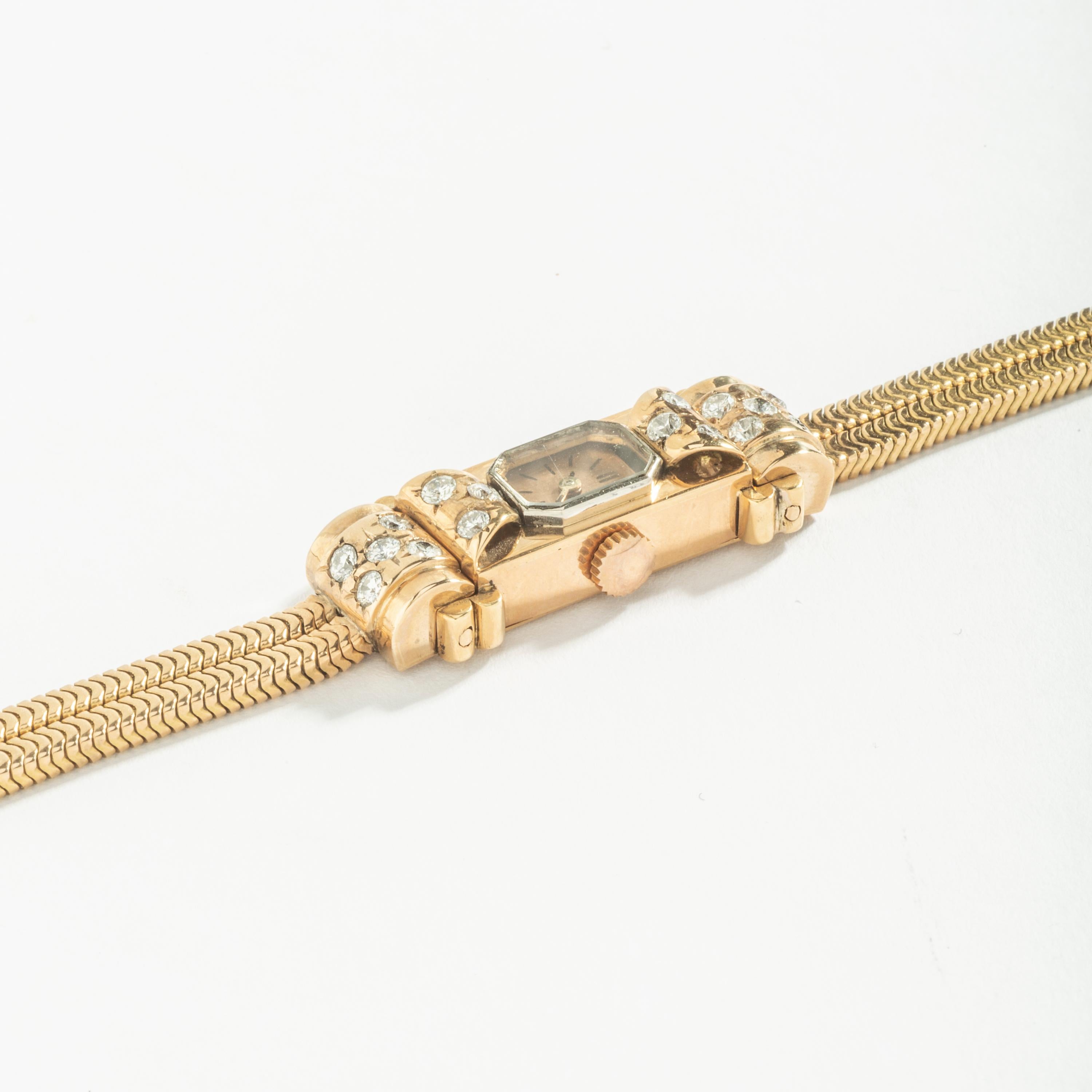 Art Deco Diamond on Yellow Gold 18k Wristwatch. Snake skin bracelet.
Circa 1935.

The watch has not been tested to determine the accuracy of its timekeeping. Please note that we do not guarantee the future working of the movement and that a service