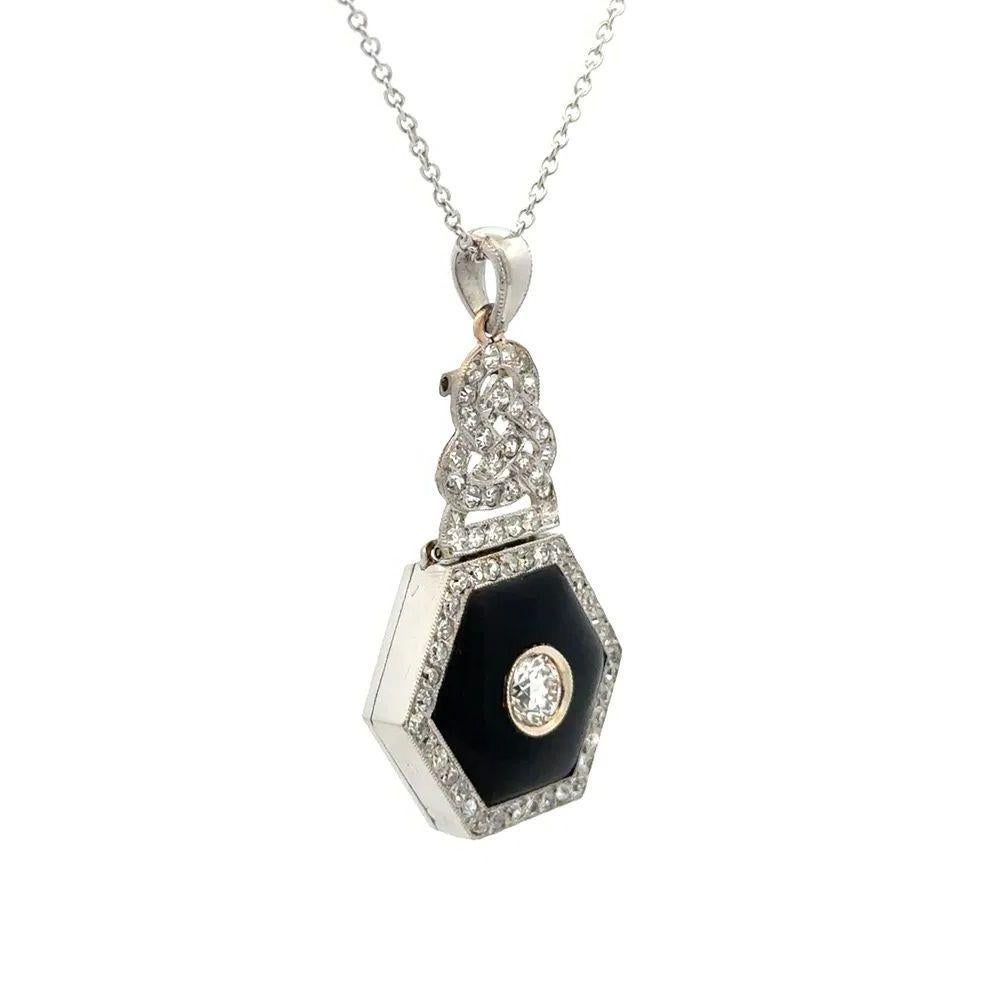 Simply Beautiful Art Deco Diamond and Hexagon Black Onyx Platinum Pendant Necklace. The Hexagon Onyx, centering a .44 Carat Old European Cut Diamond and surrounded by 1.10tcw Diamonds. Suspended from a 16” Link Chain. Approx. size of pendant: 1.5”