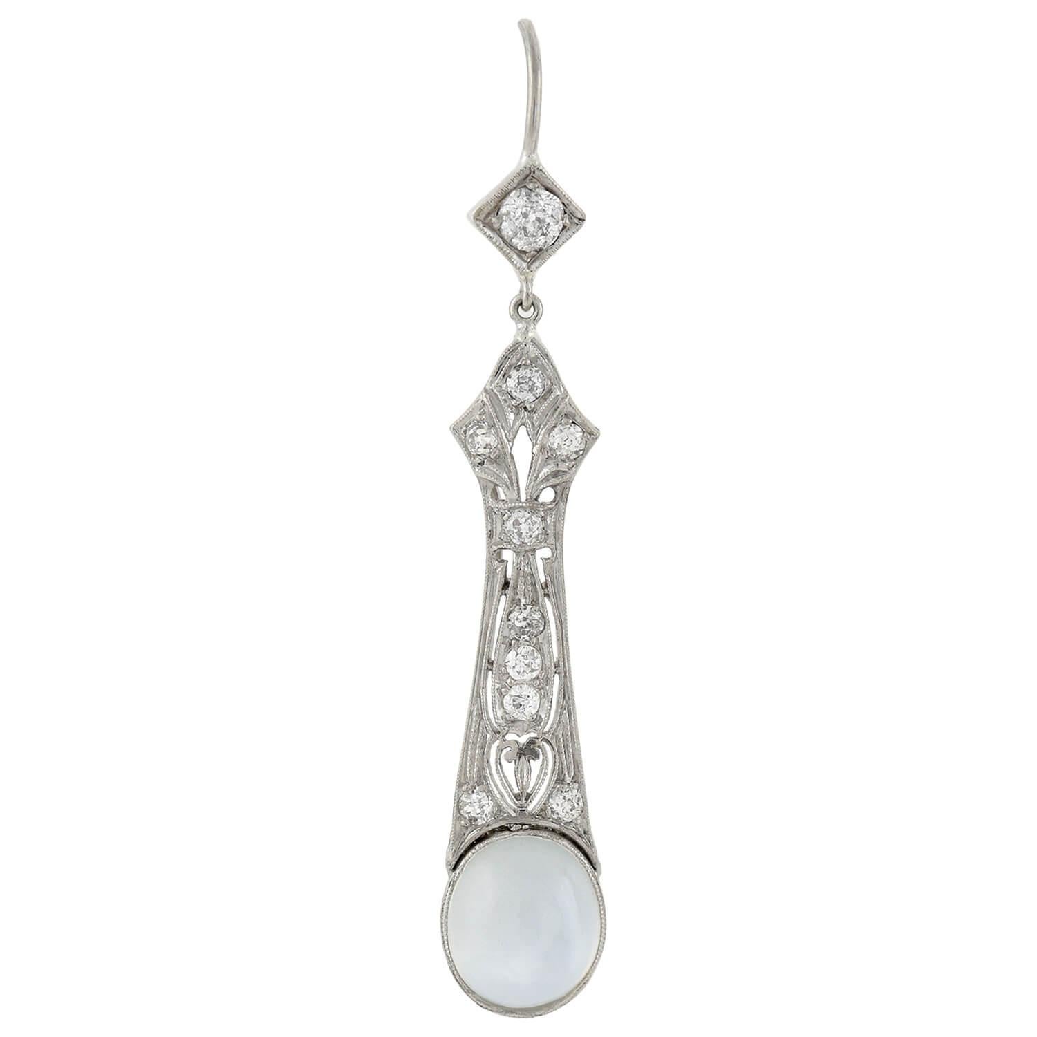 Exquisite moonstone earrings from the late Art Deco (ca1930s) era! These stunning earrings are crafted in platinum and adorned with delicate diamonds and alluring moonstones. With an elongated drop shape, the earrings feature a beautiful bezel set