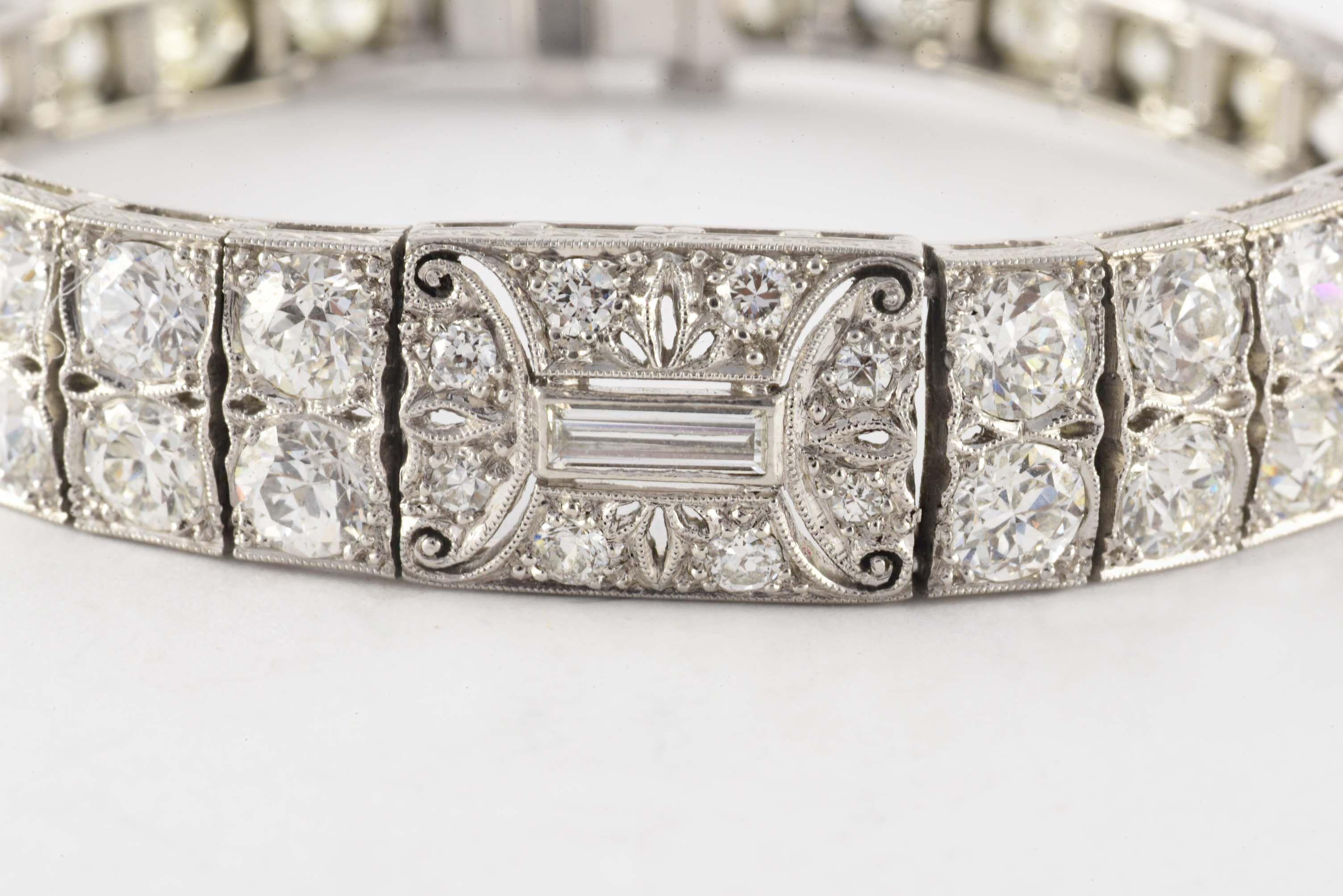 This classic Art Deco bracelet features a mix of fifty-eight Old European cut, single cut and baguette-shaped diamonds, G-H color, VS-SI clarity, totaling approximately 9.56 carats within a subtle geometric design and accented with twelve special