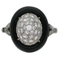 Art Deco diamond and onyx cluster ring, circa 1925.