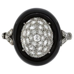 Antique Art Deco diamond and onyx cluster ring, circa 1925.