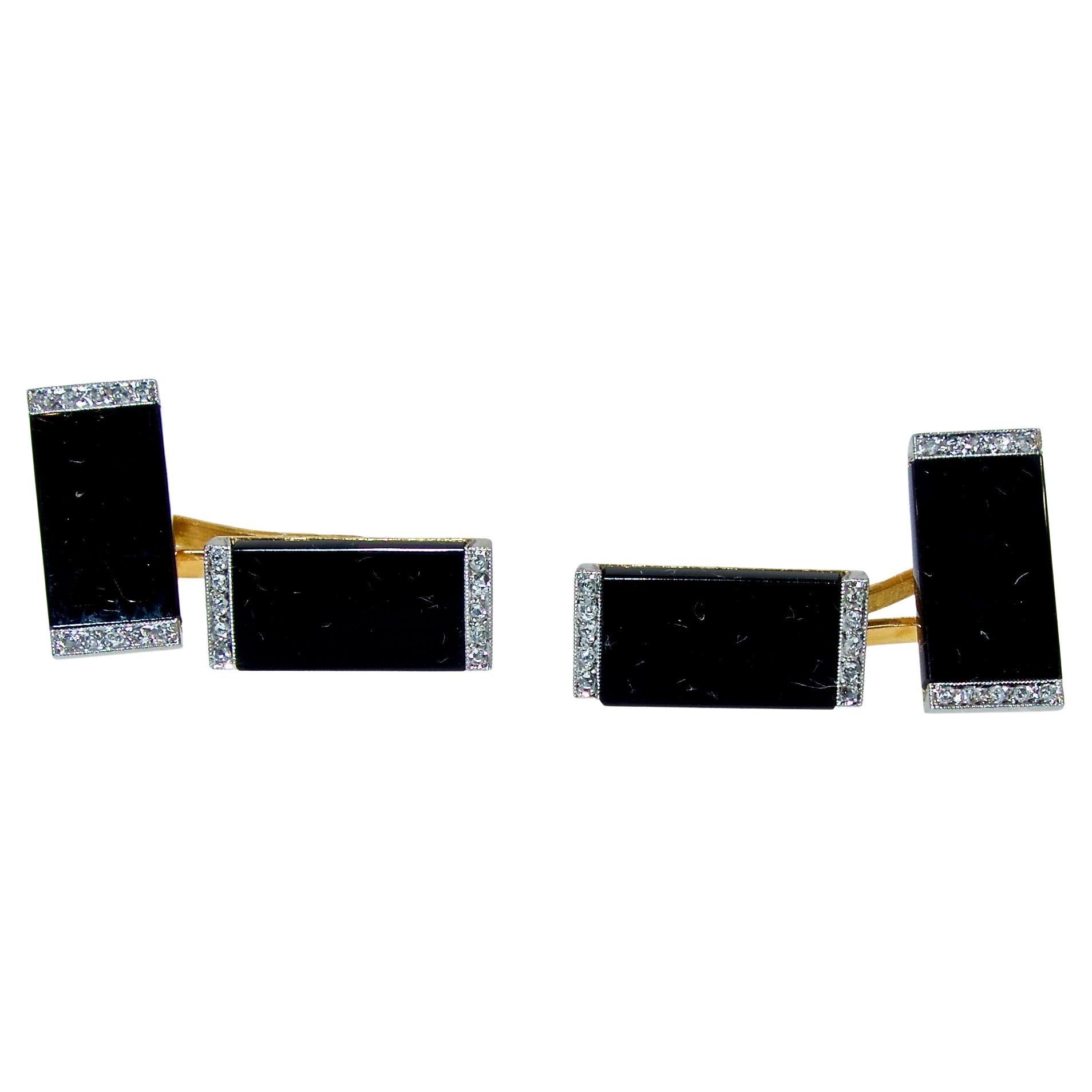 Art Deco back to back cufflinks.  Ghiso, the famous French house made these back to back 18K cufflinks, circa 1925.  Onyx panels are bordered with 30 rose cut diamonds set in platinum.  Well made, (this type of linked center is a favorite as they