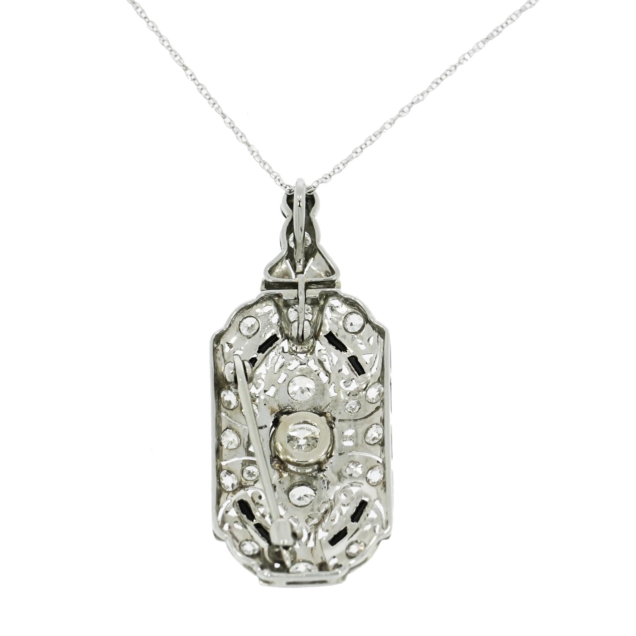 This gorgeous platinum brooch/pendant in the Art Deco Style, is centered with a sparkling old mine cut diamond weighing approximately 1.00ct. and smaller old mine cut diamonds weighing approximately 1.25 carats total. The diamond are graded H-I