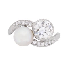 Antique Art Deco Diamond and Pearl Two-Stone Twist Ring, circa 1920s