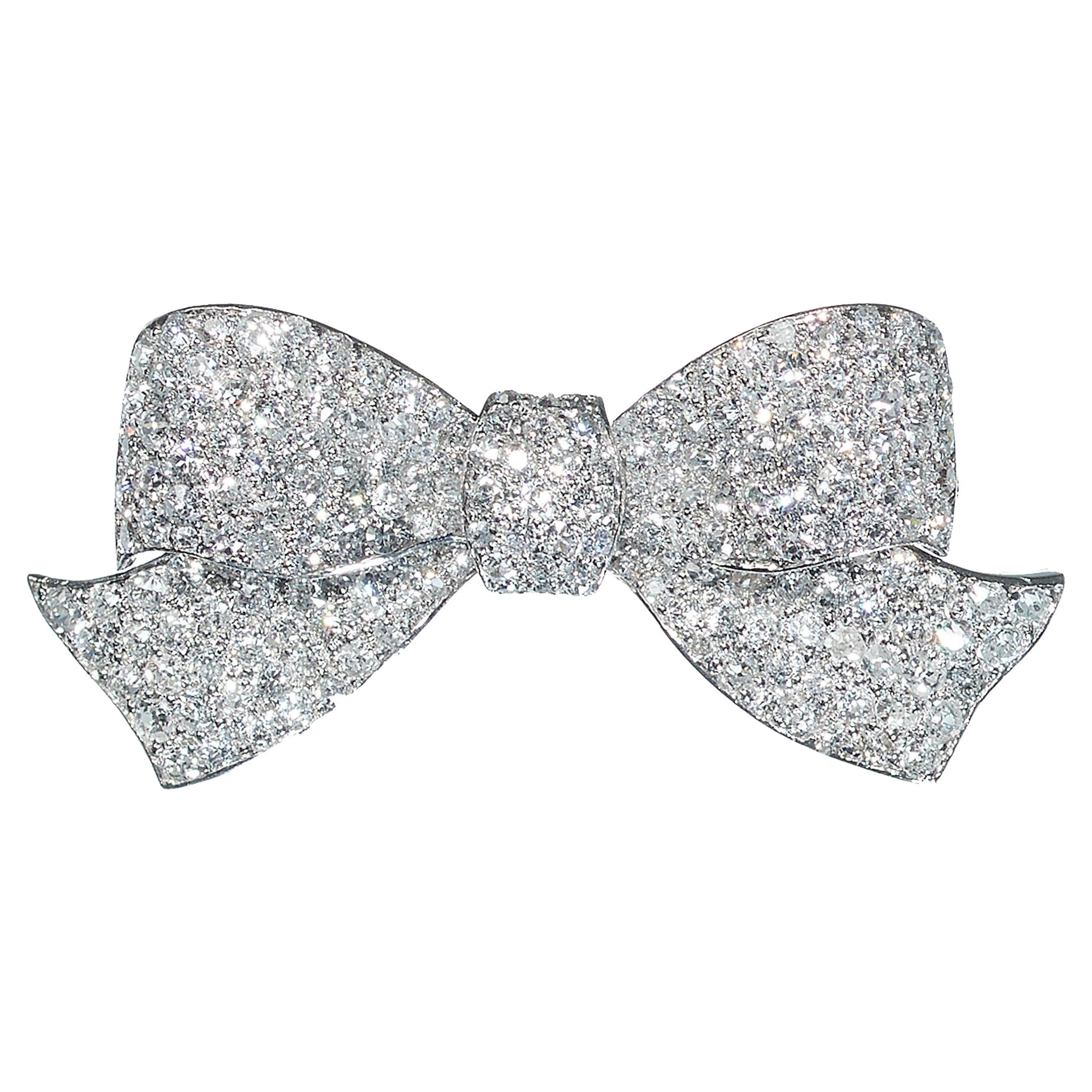 Art Deco Diamond And Platinum Bow Brooch, Circa 1925 For Sale