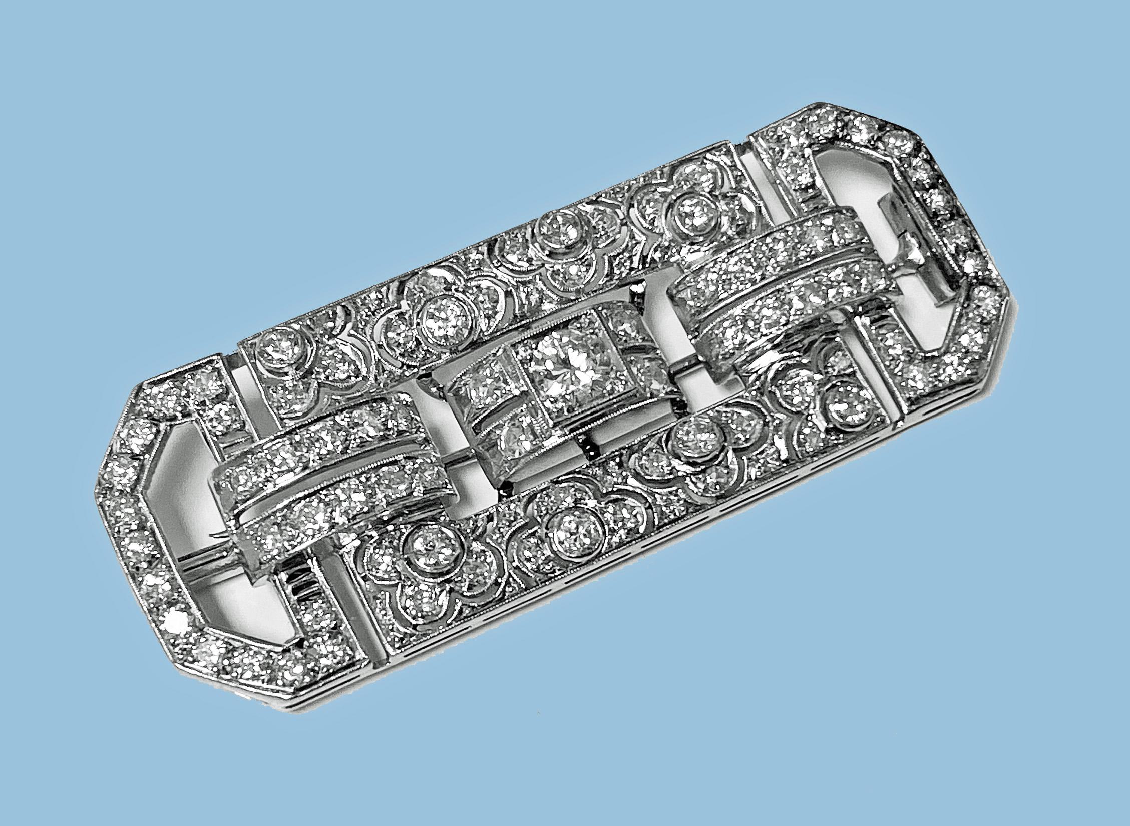 Large Art Deco Diamond and Platinum Brooch C.1925. The brooch of rectangular chamfered corners shape, milligrain set with 86 mixed round brilliant, swiss and single cut diamonds, total approximate weight of 3.85 cts, average VS1-SI1 clarity, average