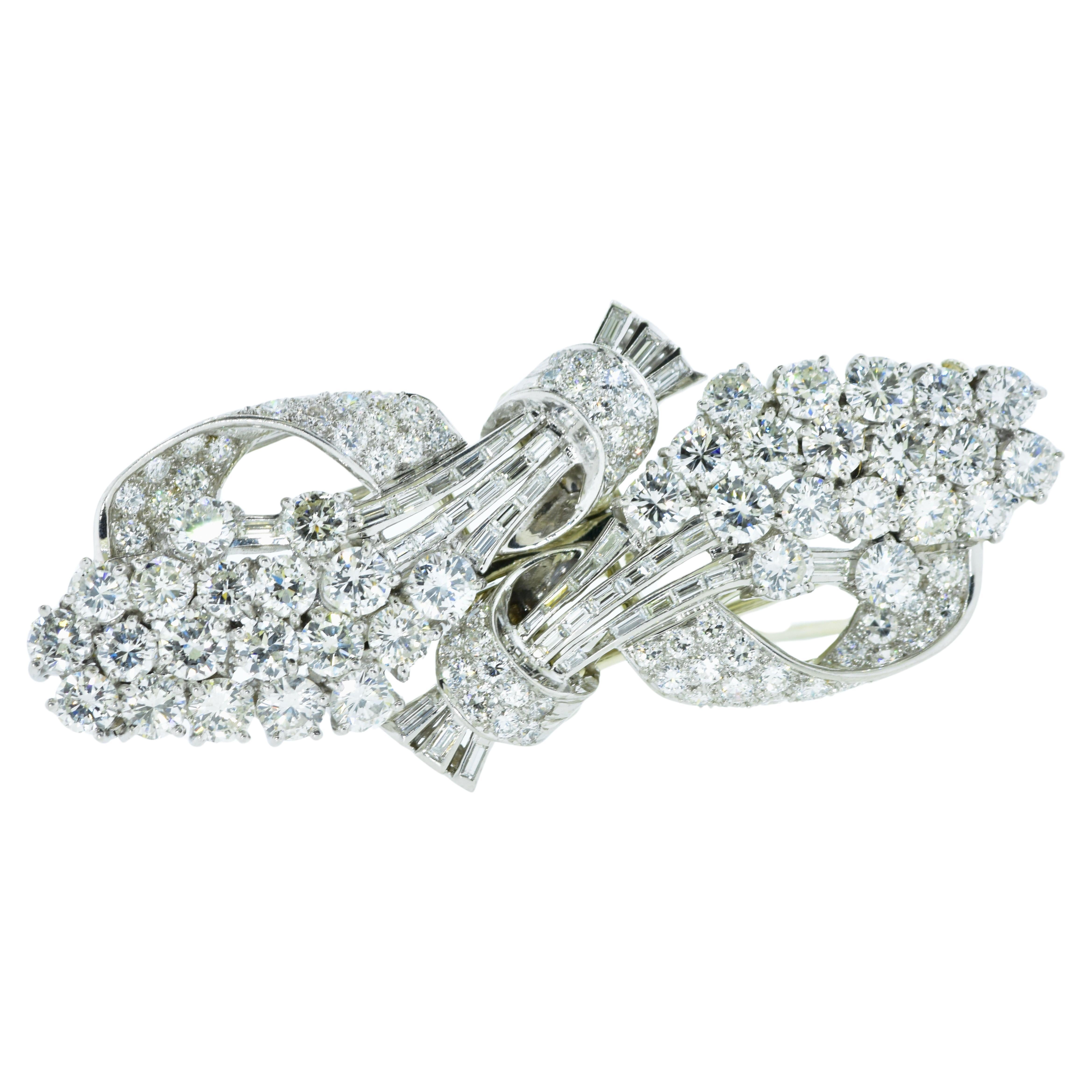 Art Deco Diamond Clips in platinum.  Well made with fine white diamonds the brooch can be worn together or separated into separate dress clips.  There are 10 cts of near colorless (G/H) in both European cut diamonds are baguette cut diamonds.  The