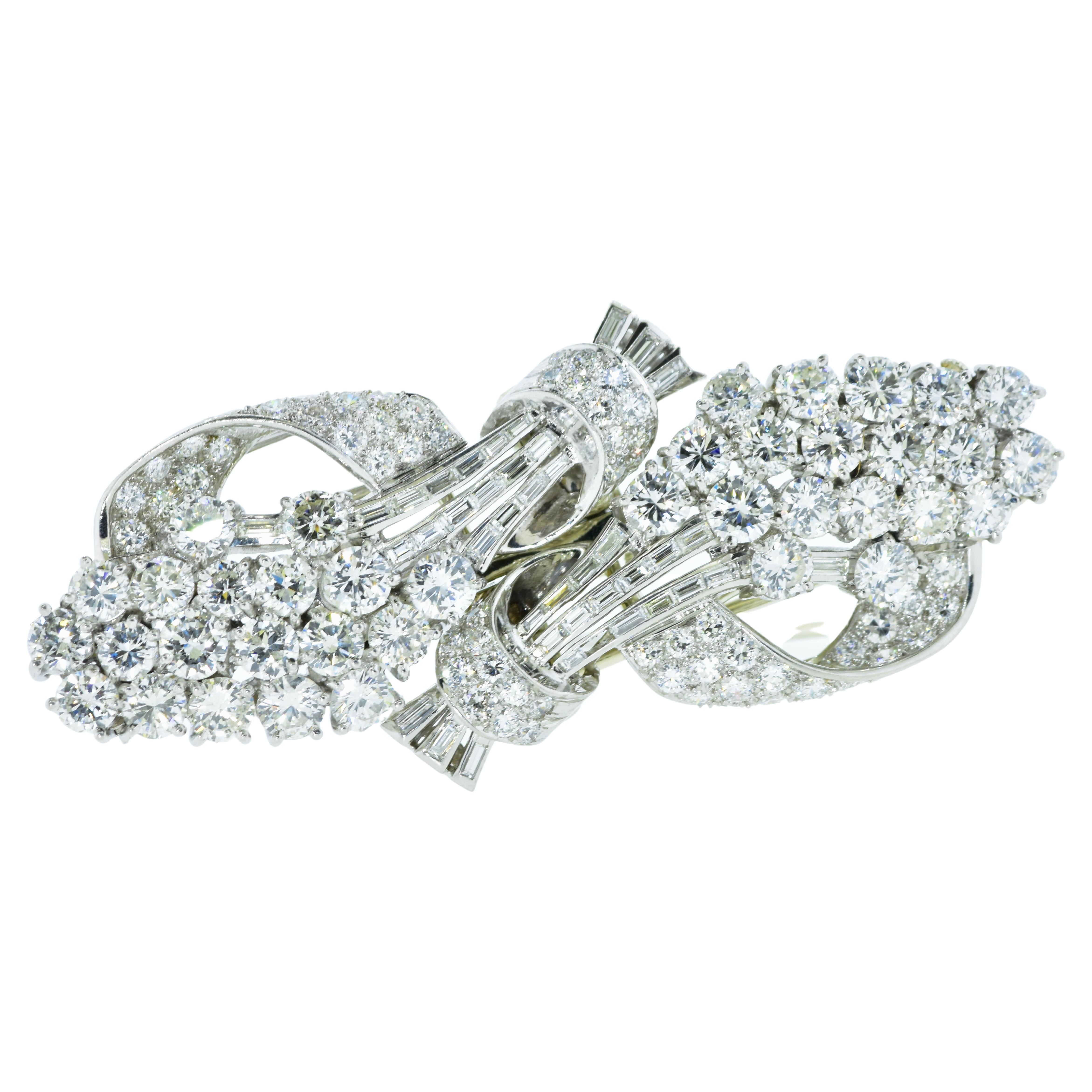 Art Deco Diamond Clips in platinum.  Well made with fine white diamonds the brooch can be worn together or separated into separate dress clips.  There are 10 cts of near colorless (G/H) in both European cut diamonds are baguette cut diamonds.  The