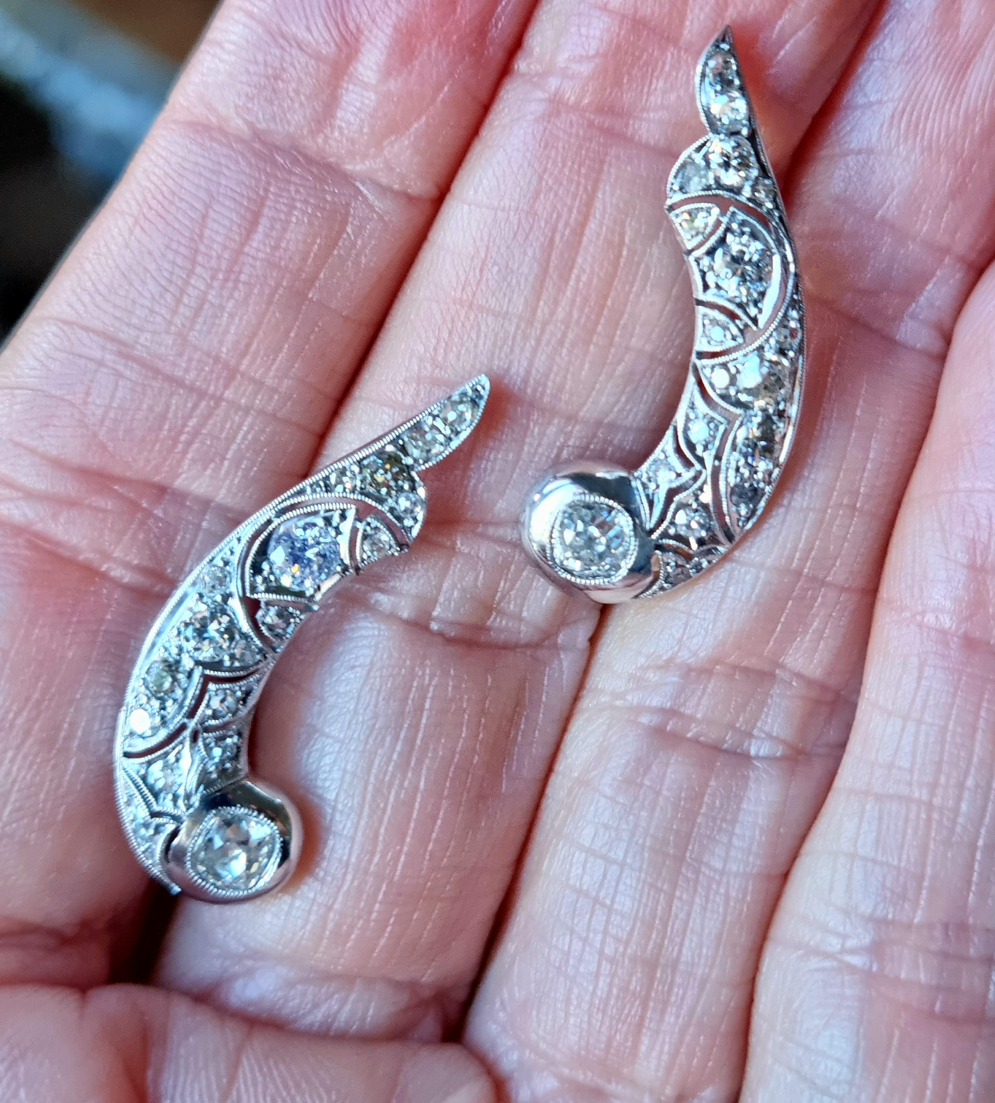 Art Deco Up & Down Platinum Climbing  Diamond Pair of Earring. 
A pair of Art Deco diamond earrings, each earring in the form of fish shape encrusted with old European and early brilliant- (4.95X4.33X2.65mm) each, the diamonds estimated to weigh