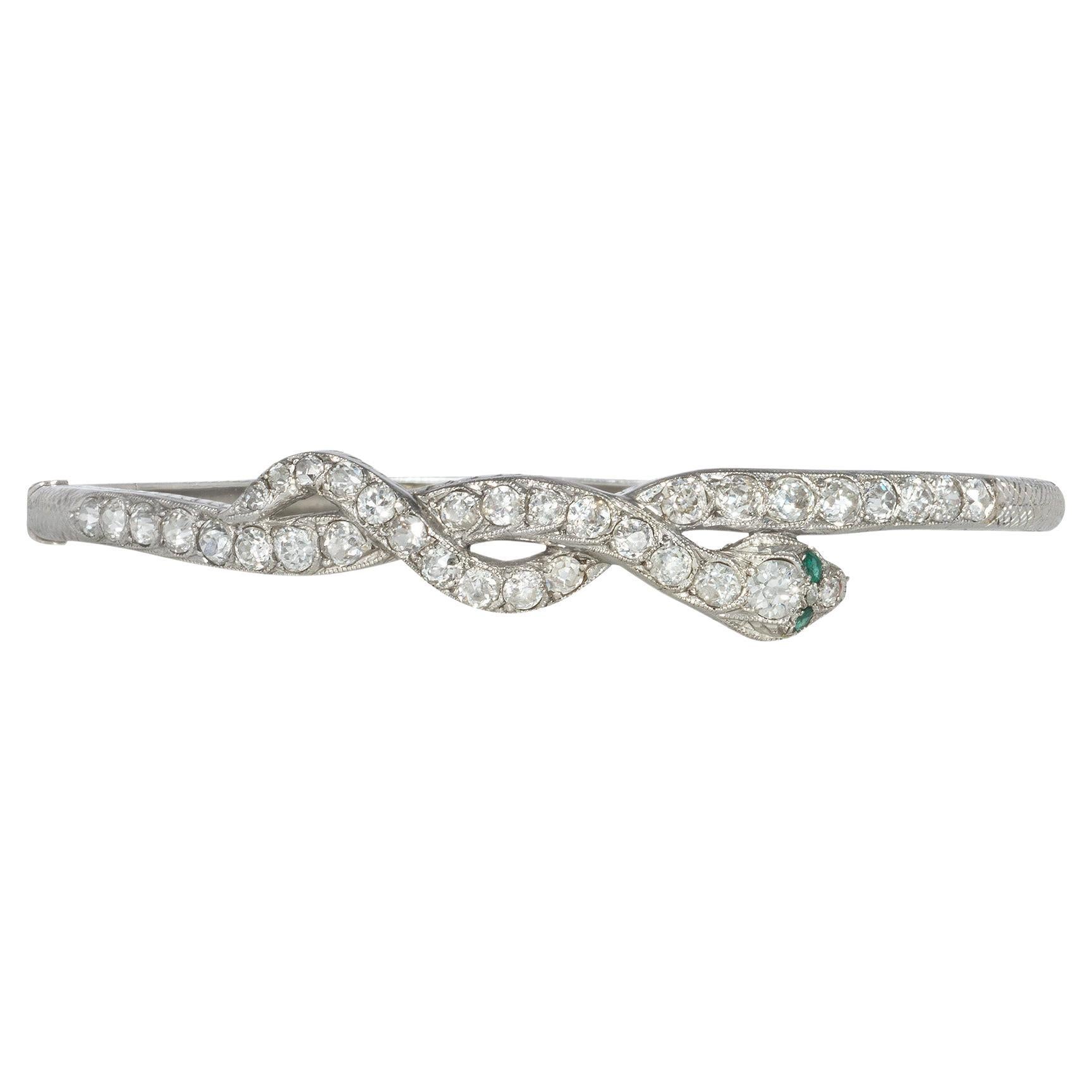 Art Deco Diamond and Platinum Entwined Snake Bracelet with Emerald Eyes For Sale