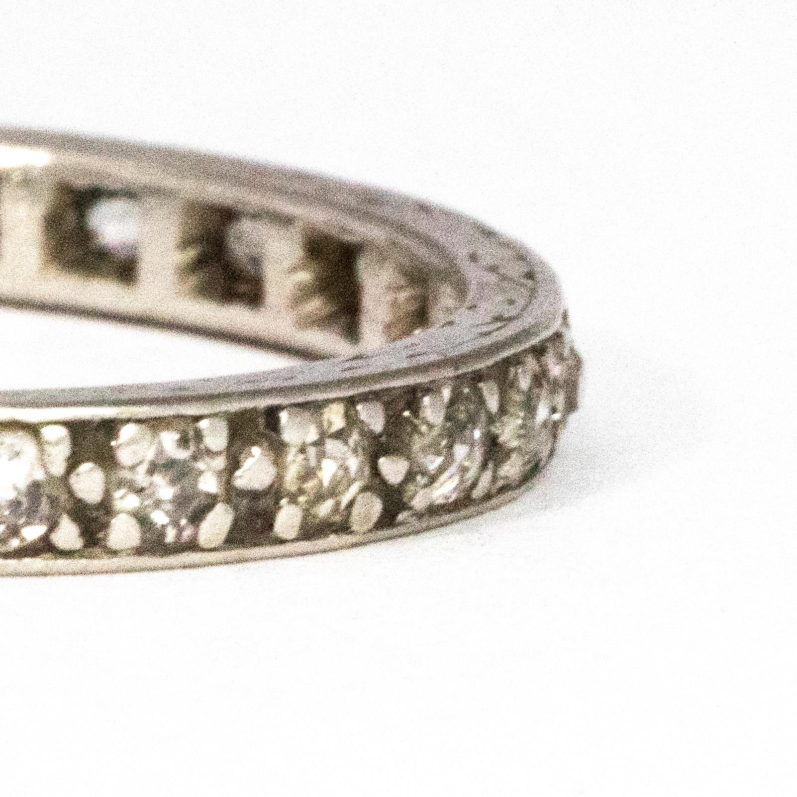 Each sparkling diamond measures 3pts each and are set flush into the eternity band. The ring has a delicate feel and a wonderful shimmer.

Ring Size: N or 6 3/4
Band Width: 2mm