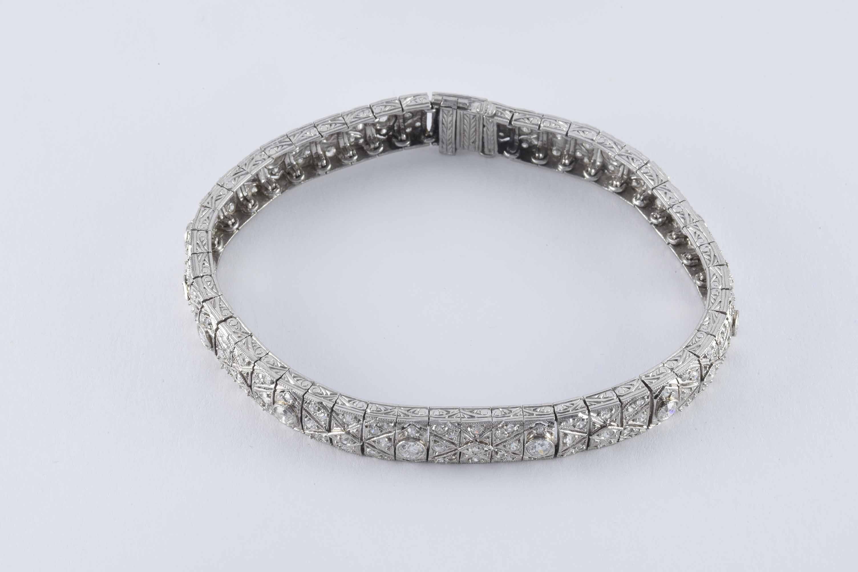 This classic Art Deco link bracelet is designed around twelve Old European cut diamonds totaling approximately 1.80 carats and embellished with 180 single cut diamonds totaling approximately 3.26 carats, G-H color, VS-SI clarity in geometric