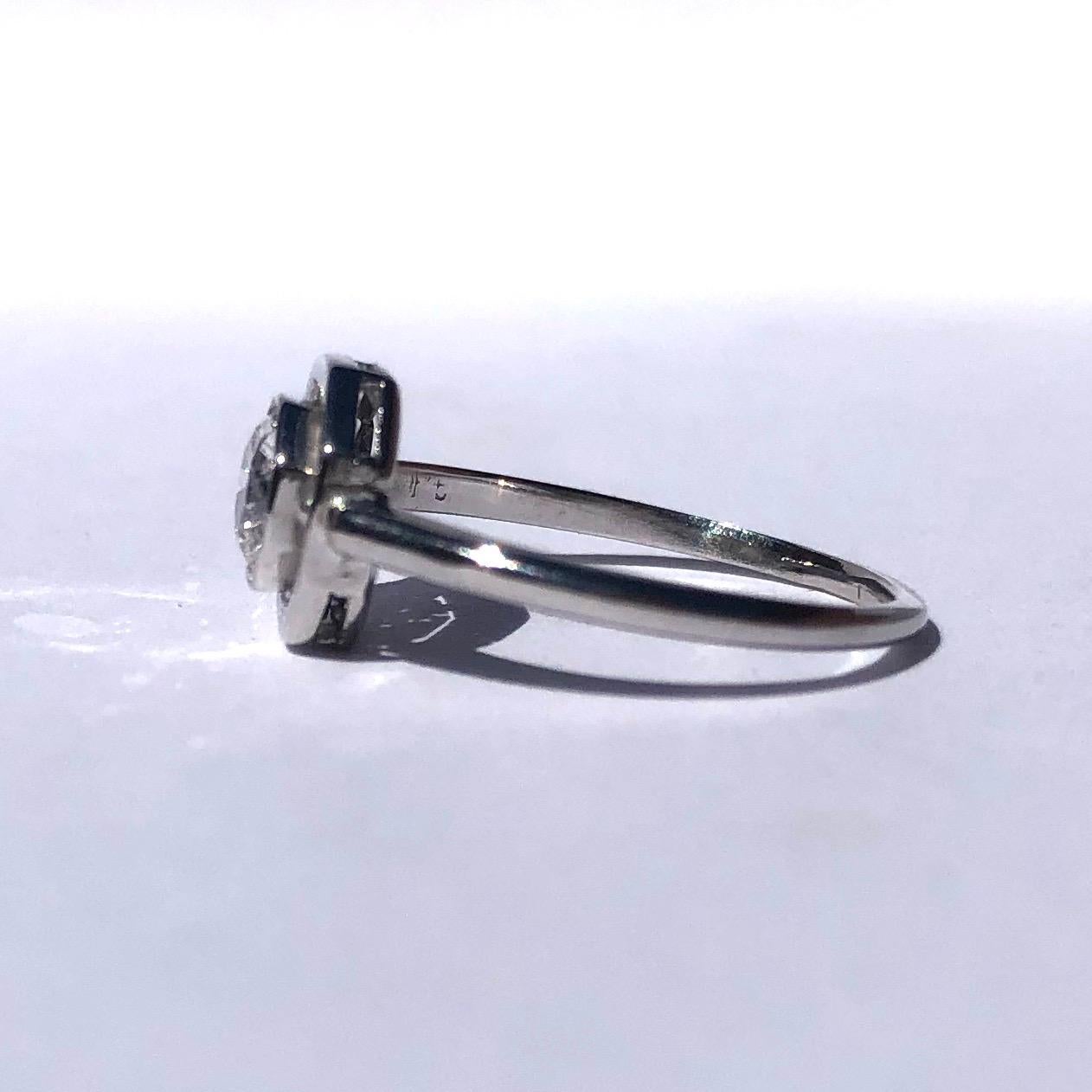 The style of this ring is simply stunning. In typical Art Deco style the geometric shape of the face and setting holds a bright sparkling diamond measuring 50pts, G/H colour VS1. 

Ring Size: I or 4 1/4 
Face Dimensions: 8x8mm 

Weight: 2.1g