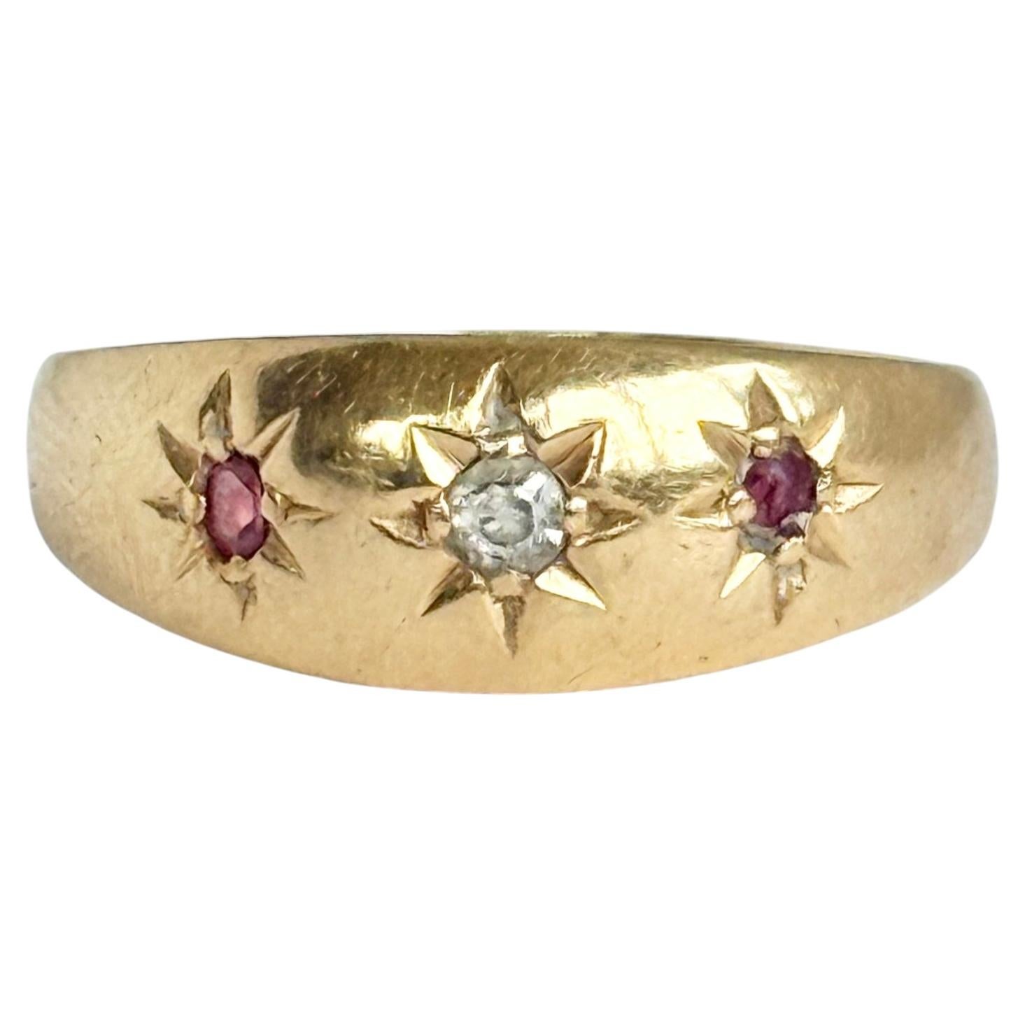 Anello Art Déco con diamanti e rubini, montatura a stella in oro 18 carati