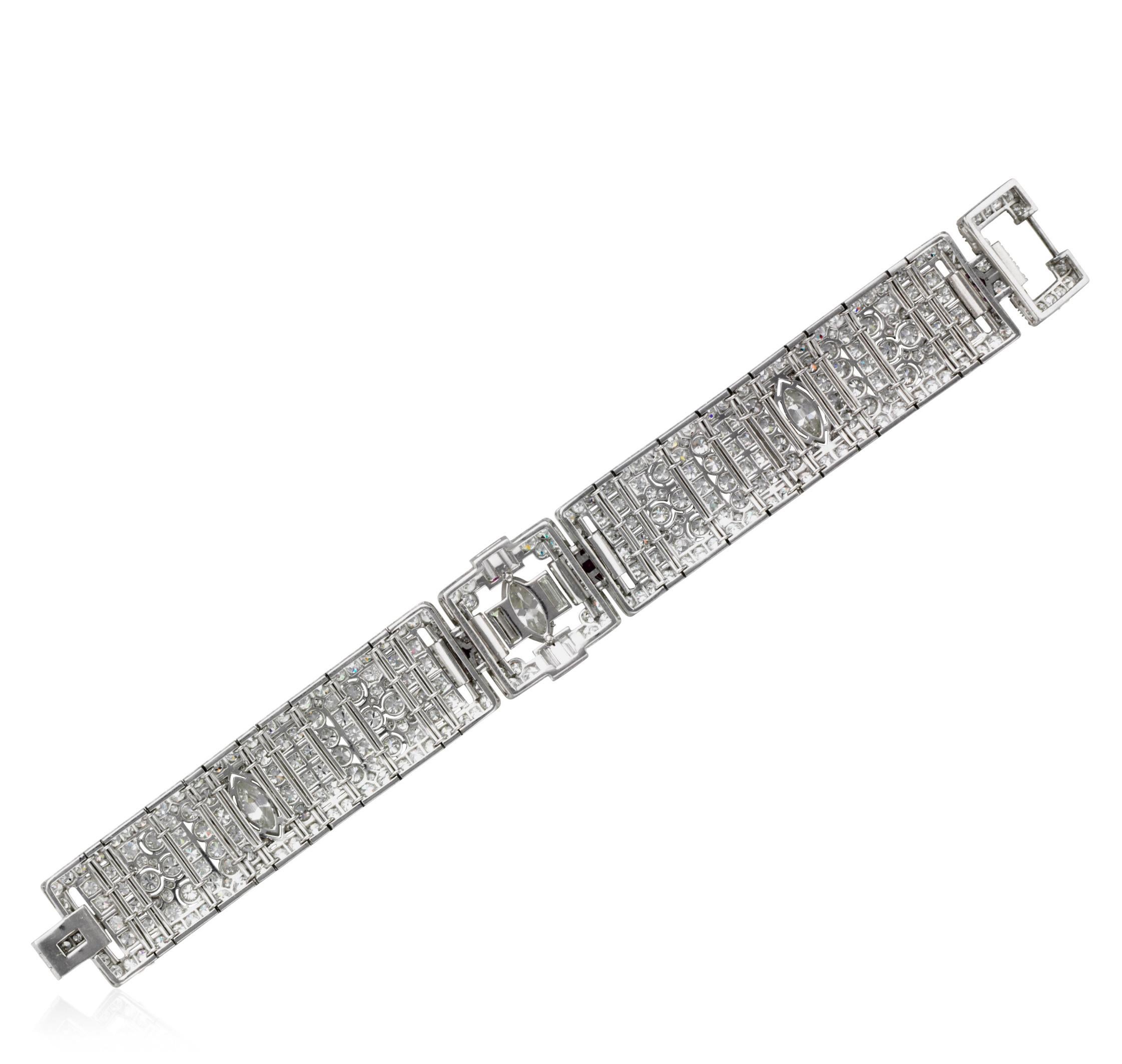 This Platinum Art Deco bracelet is featured with openwork of articulated design.  It is enhanced with 306 round brilliant cuts and 10 single-cut diamonds with an approximate total weight of 11.00 carats, 3 marquise shaped diamonds weighing