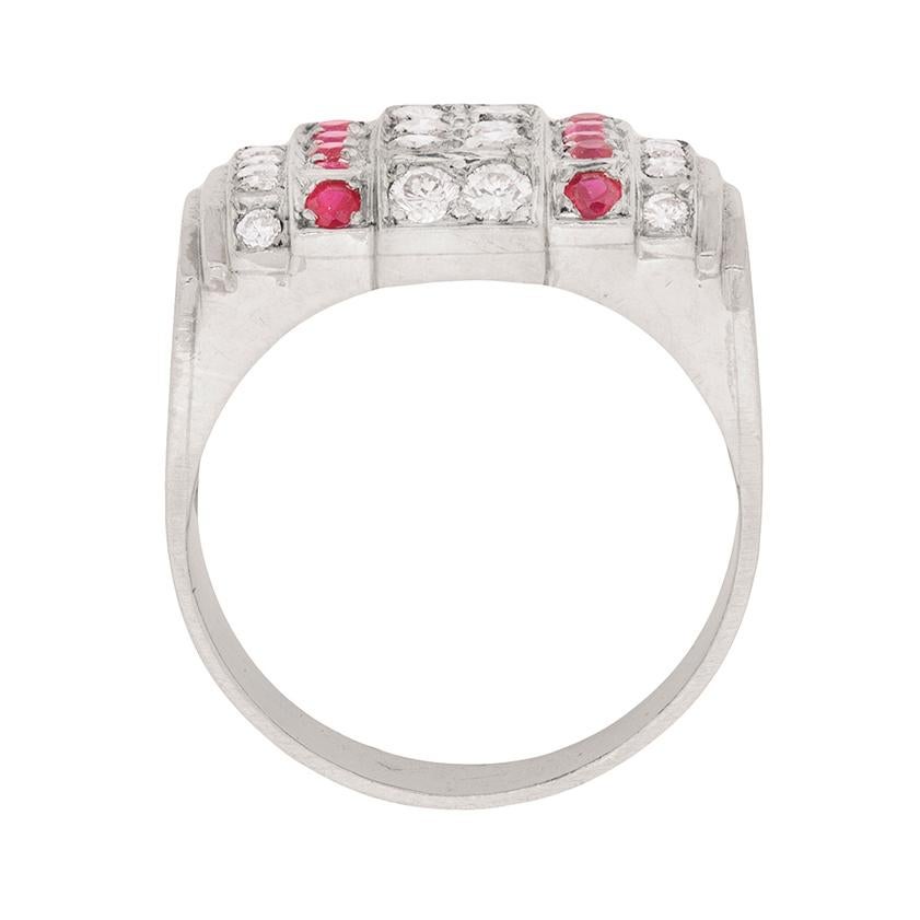 This is the perfect dress ring for someone looking to make an impression. The beautifully set diamonds are rubies work in perfect cohesion with one another, and the structured, symmetry design is classic of the 1940s. The diamonds are round