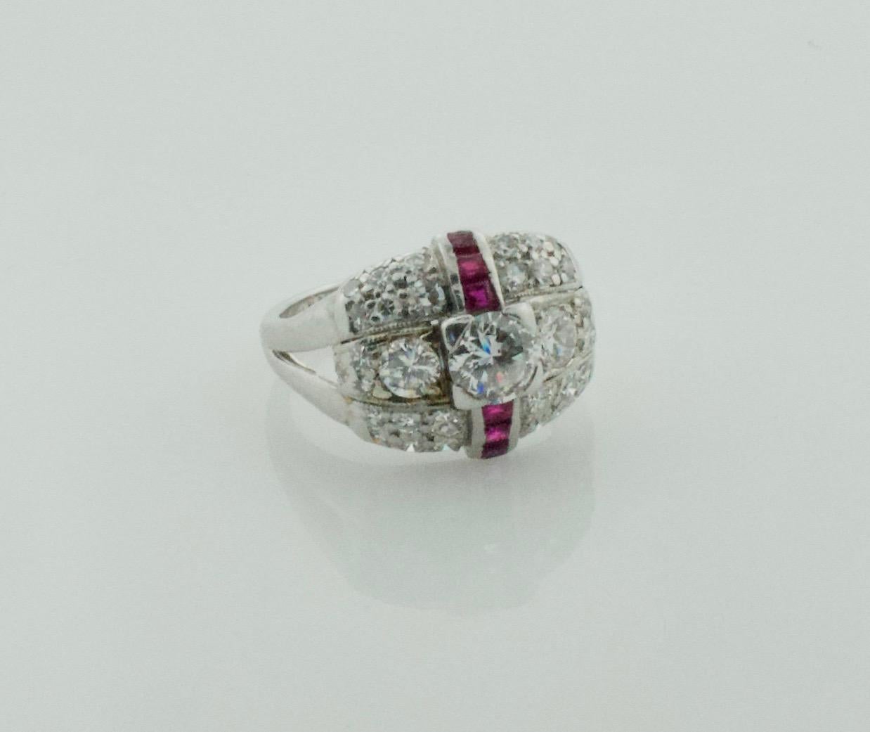 Art Deco Diamond and Ruby Ring in Platinum
One Round Brilliant Cut Diamond weighing .60 carats approximately [H - VS2]
Two Round Brilliant Cut Diamonds weighing .45 carats approximately  [H - VS2]
Thirty Round Single Cut Diamonds weighing .75 carats