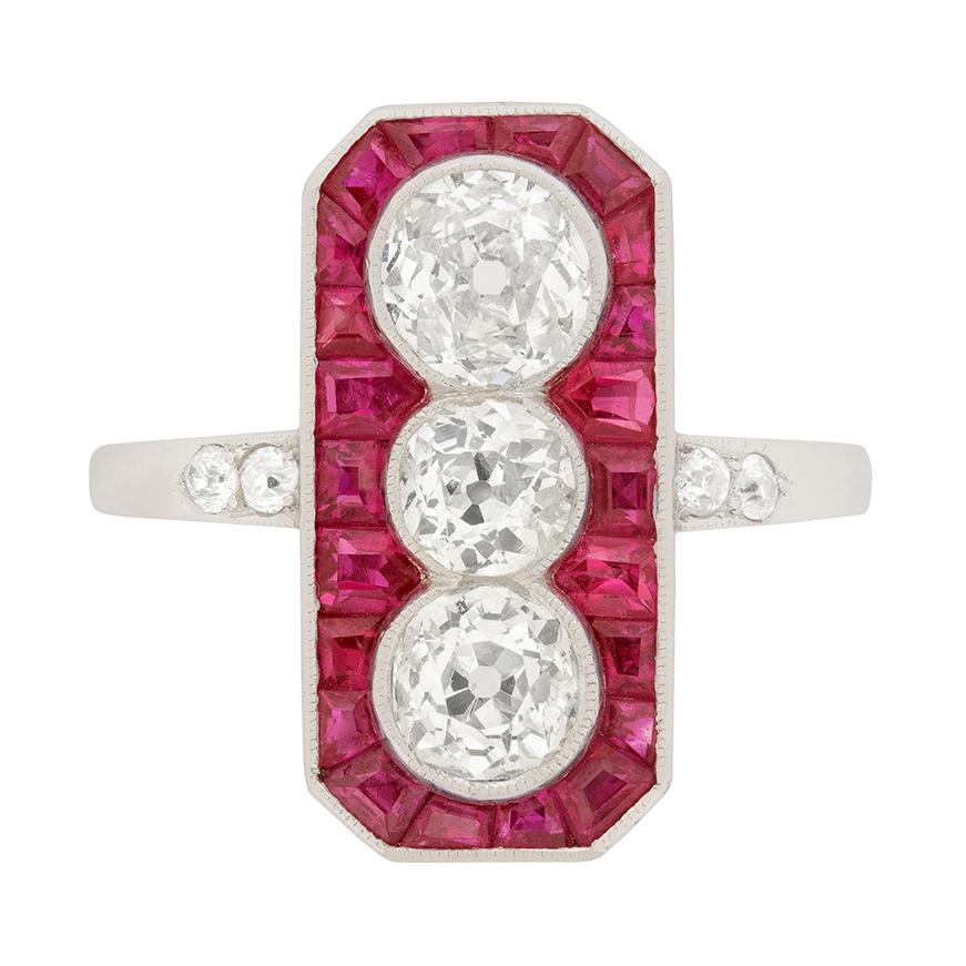 Art Deco Diamond and Ruby Three-Stone Halo Ring, circa 1920s For Sale