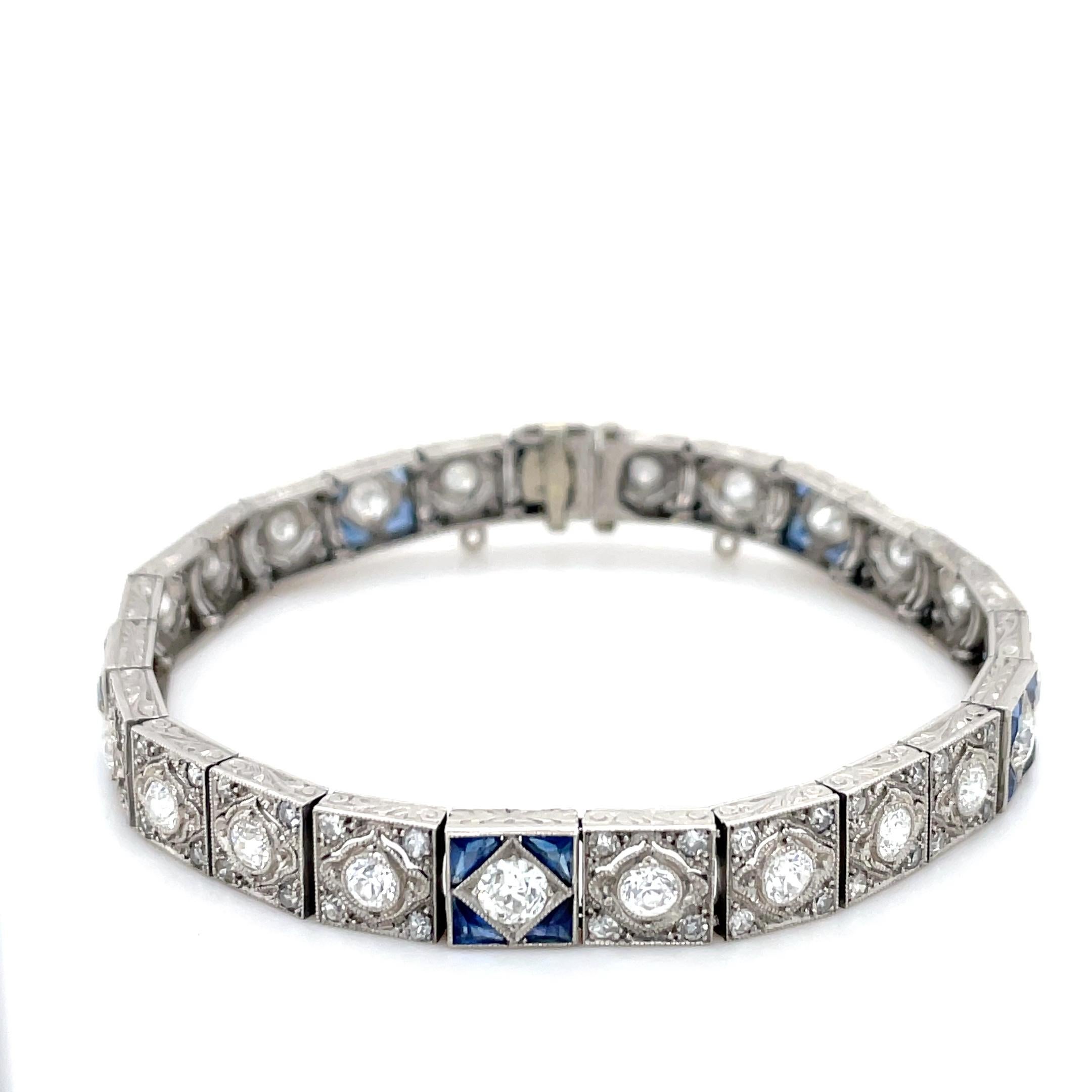 This unique Art Deco bracelet contains numerous old European and single cut diamonds weighing approximately 6.00 carats total with five stations containing triangular cut sapphires. Carefully crafted in platinum, and beautifully designed, this