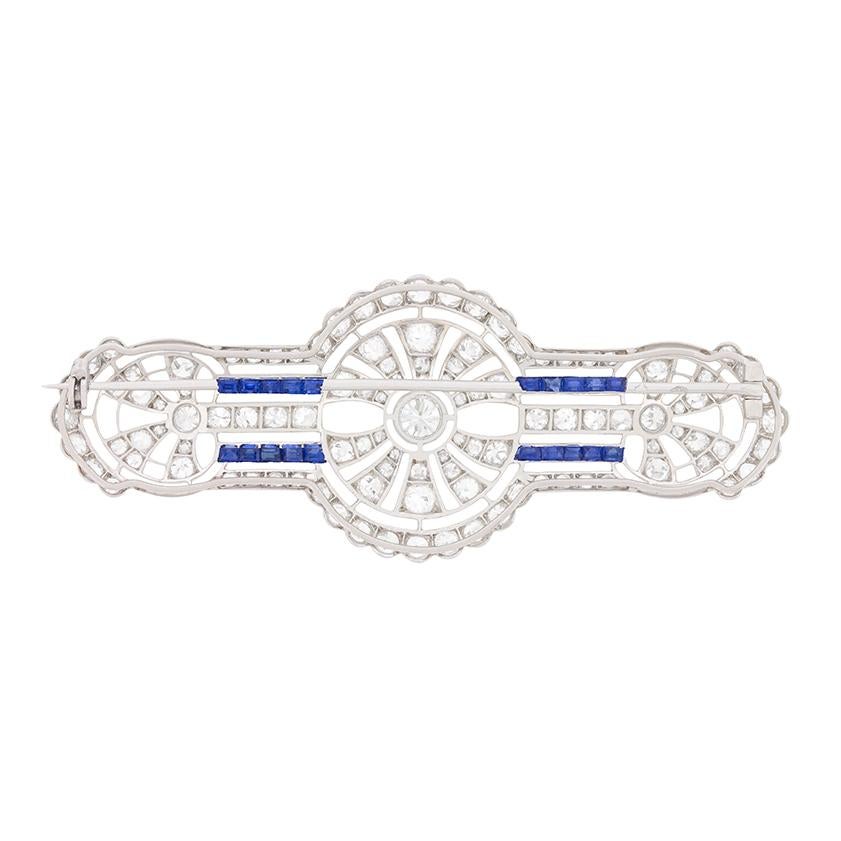A beautifully handmade brooch with a collection of sparkling diamonds and sapphires. The diamonds are old cut stones, with the central stone weighing 0.50 carat and the remaining totalling 5.00 carat. All the diamonds are top quality, estimated as F