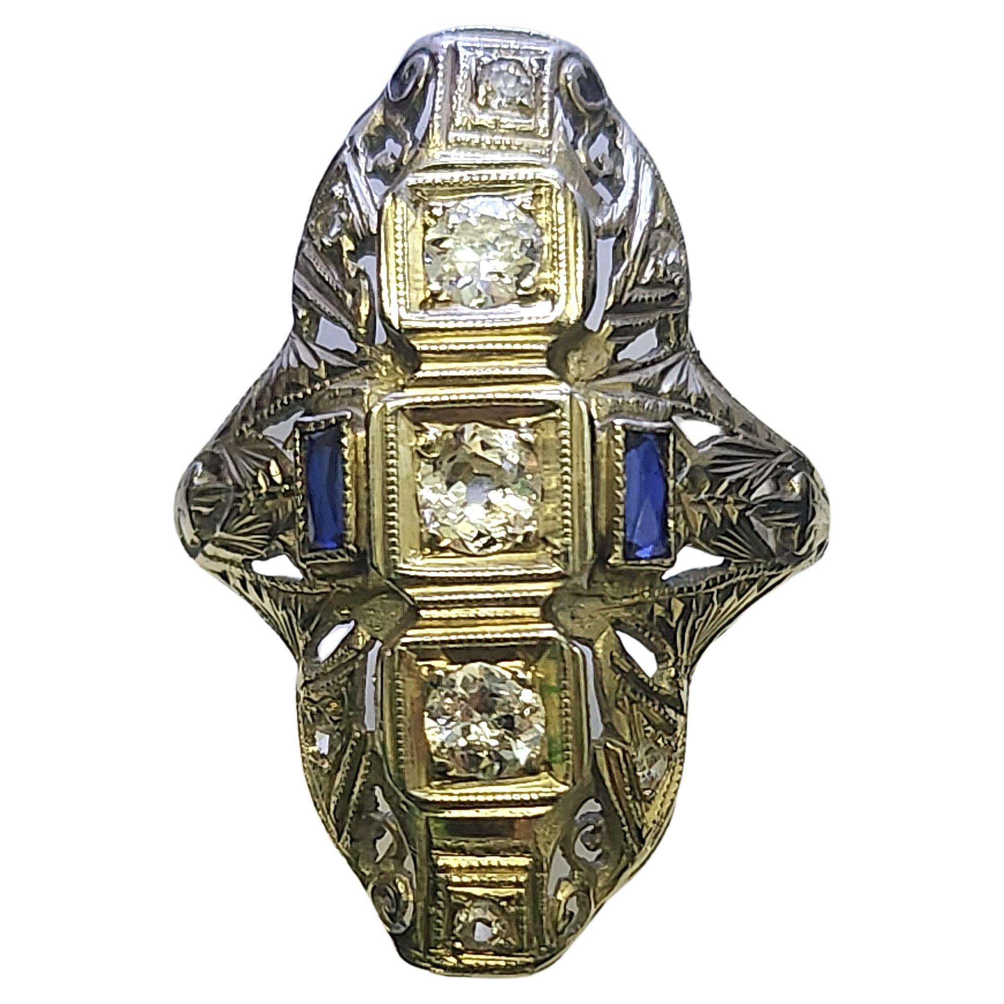 Art deco large ring in 18k white gold and old european cut diamonds with an estimate weight of 0.50 carats flanked with blue sapphire ring head diameter 25mm×11mm width and total gold weight 4.50 grams hall marked 18k dates back to europe 1920s