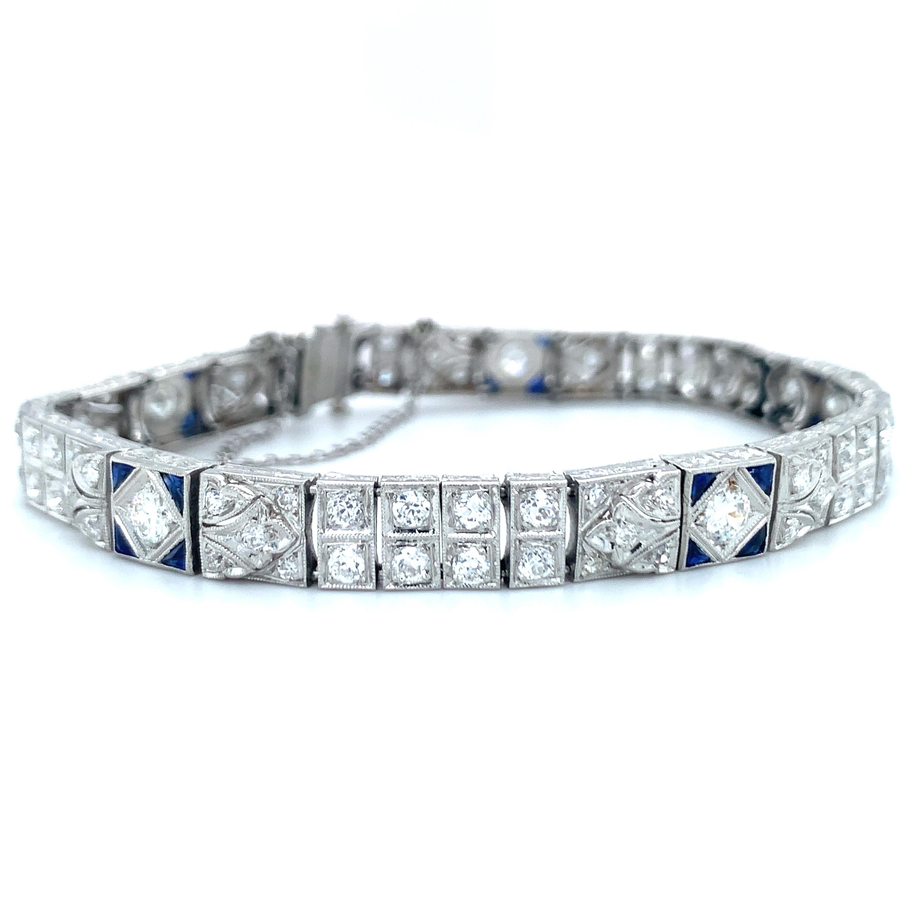 One Art Deco diamond and sapphire bracelet handmade in platinum featuring 95 old European cut diamonds weighing a total of 4 ct. with I-J color and SI-1 clarity. The bracelet holds a flexible make and is enhanced with sapphire accents and engraved