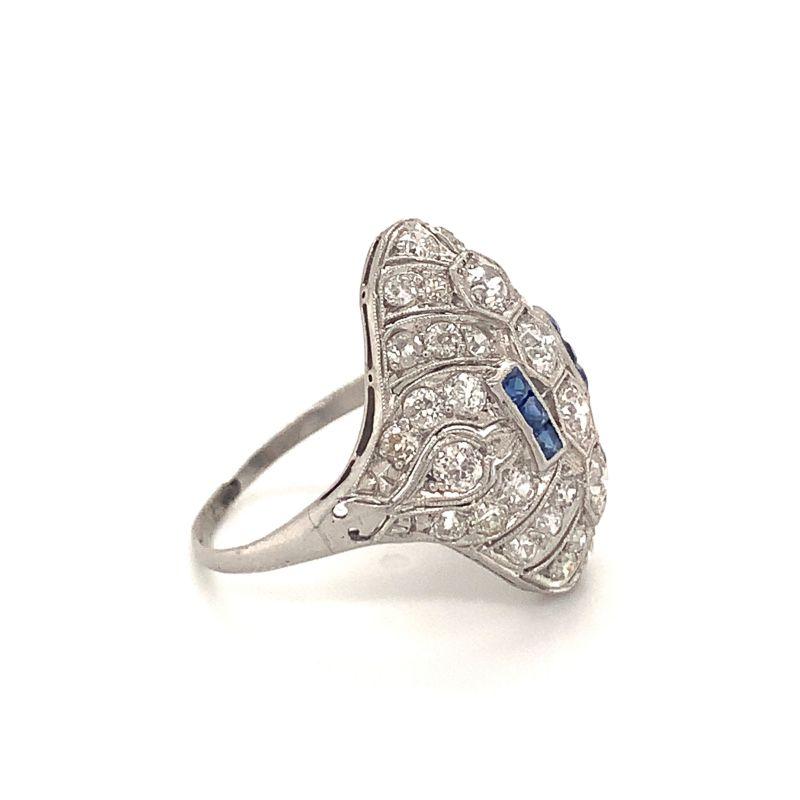 Art Deco diamond and sapphire platinum filigree dome ring featuring forty old European cut diamonds weighing approximately 2.25 ct. with J-K color and SI-1 clarity. Enhanced by six french cut sapphires weighing approximately 0.30 ct.

Stunning,