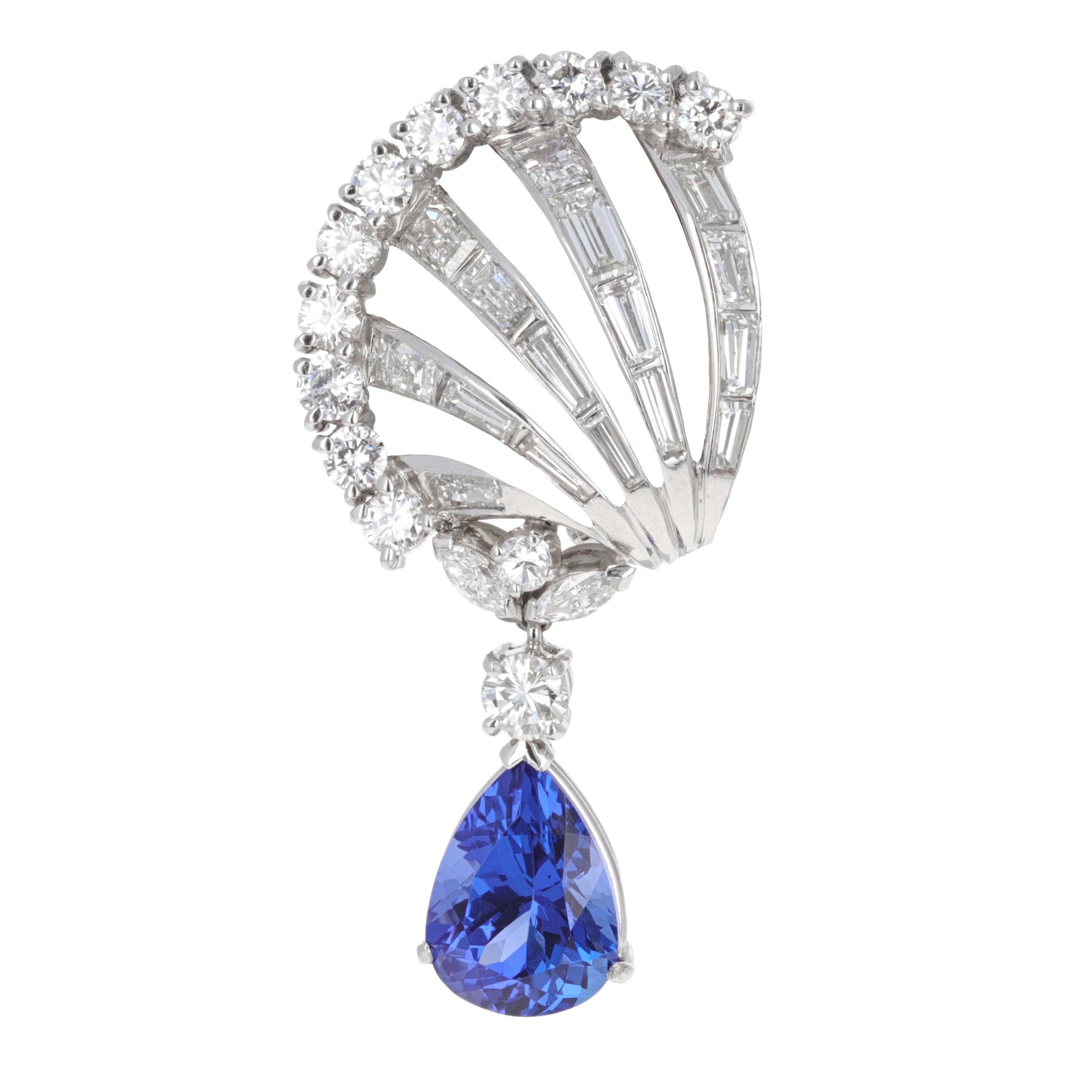 Art Deco Diamond and Tanzanite clip-on dangle earrings. The earrings are made in platinum and 14 karat white gold. There is an estimated total weight of diamonds weighing 3.85 carats in the earrings. The earrings have 26 round brilliant diamonds