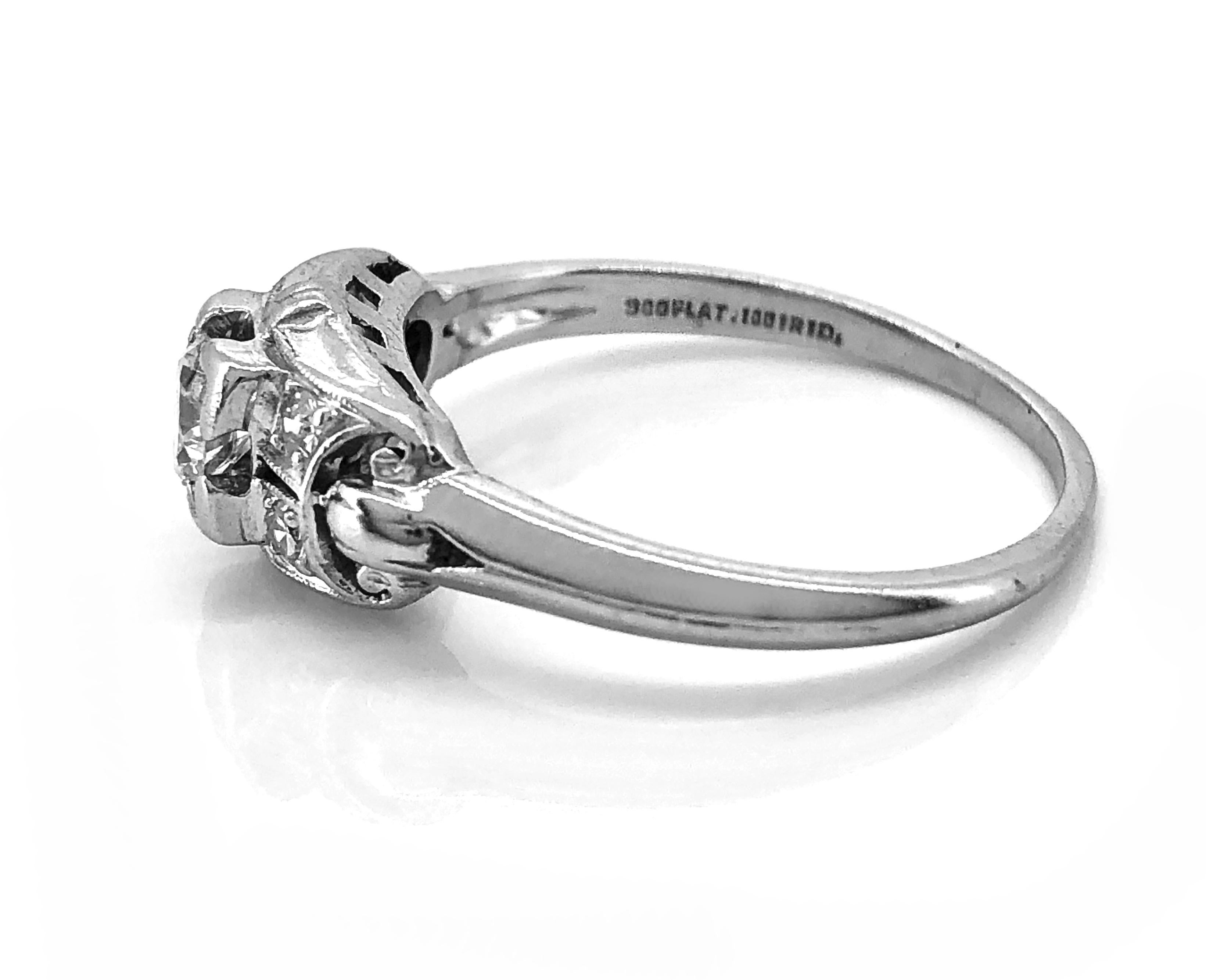 A beautiful Art Deco diamond Antique engagement ring features a .26ct. Apx. Transitional cut diamond with VS1 clarity and G color. The accenting Single cut diamonds weigh .10ct. Apx. T.W. with VS1-VS2 clarity and F-G color. This is a decorative