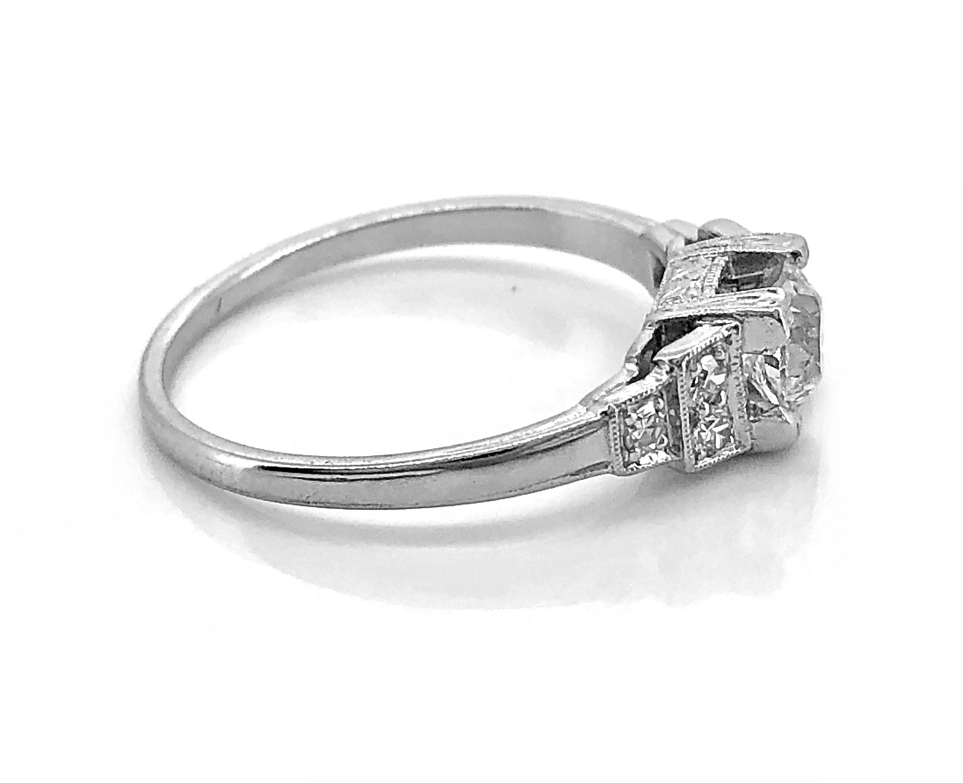 A beautiful Platinum Art Deco Antique engagement ring (Whitehouse Brothers) featuring a .47ct. Apx. European cut diamond with VS2 clarity and H color (GIA Certificate). Accenting the center diamond in a step down design are .12ct. Apx. T.W. of Old