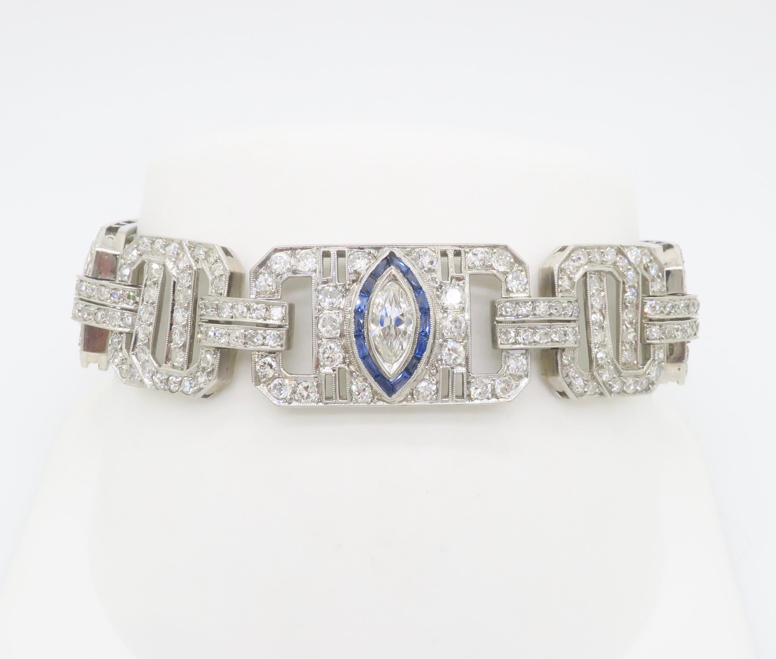 Stunning Art Deco diamond & blue sapphire bracelet crafted in Platinum.  

Gemstone: Earth Mined Diamond & Blue Sapphire
Diamond Carat Weight: 10.45CTW 
Diamond Cut: Round & Marquise Cut 
Color: E-H
Clarity: VS1-SI2
Gemstone Carat Weight: