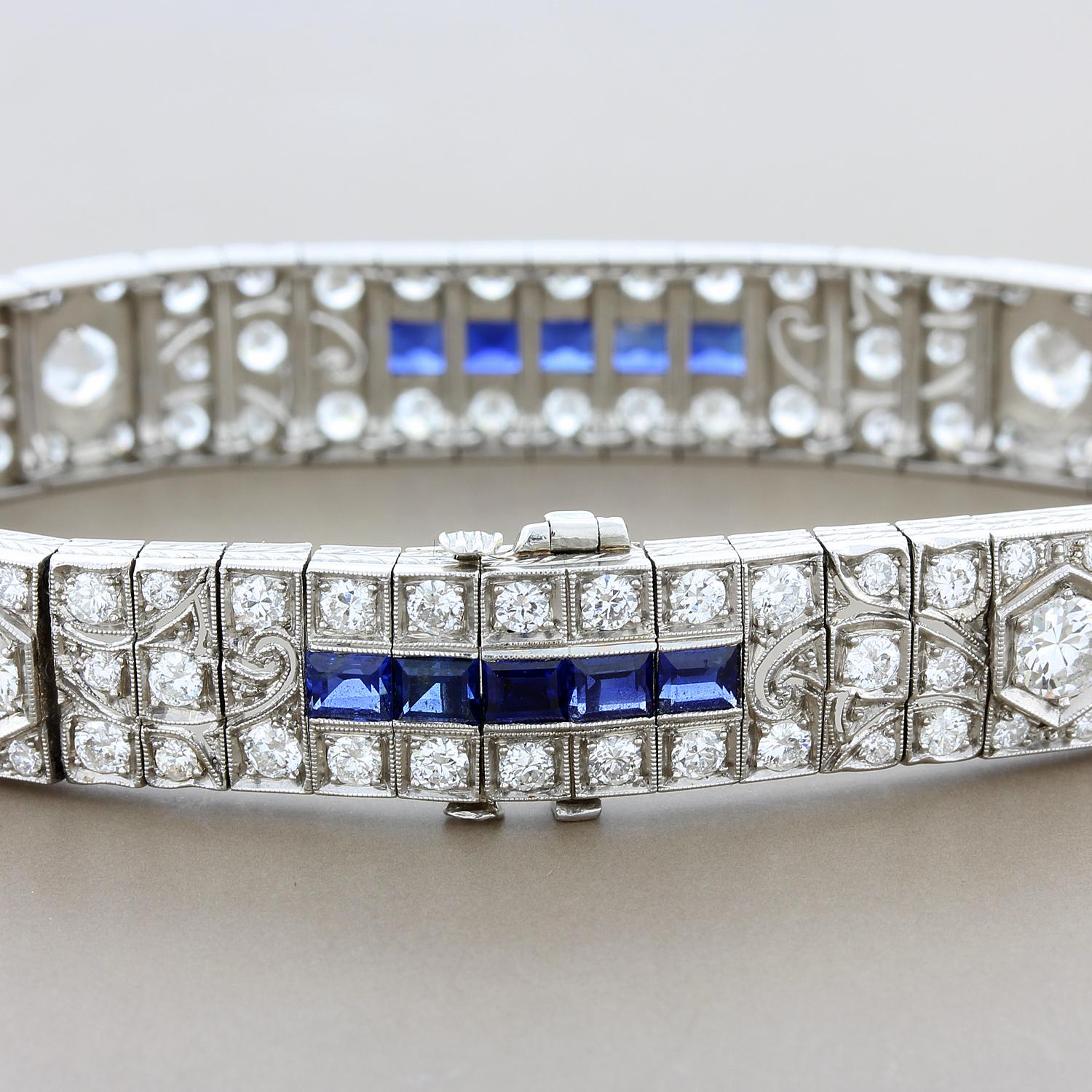 A classic Art Deco piece made in the 1930’s, this platinum bracelet features approximately 8 carats of VS quality round cut diamonds with sapphire accents. With milgrain settings and filigree casting, this is a prime example of Art Deco design and