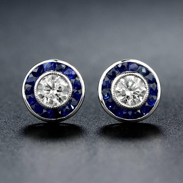 Pendant & Stud Earrings (Selling as a set)

#Pendant
Set with 0.51 Carat Weight Diamond G Color VS Clarity in the center.  Surrounded by halo of  French Cut Blue Sapphire 16 pcs. 0.55 Carat.  And another 2 Diamonds weight 0.02 carat on the bail. 
