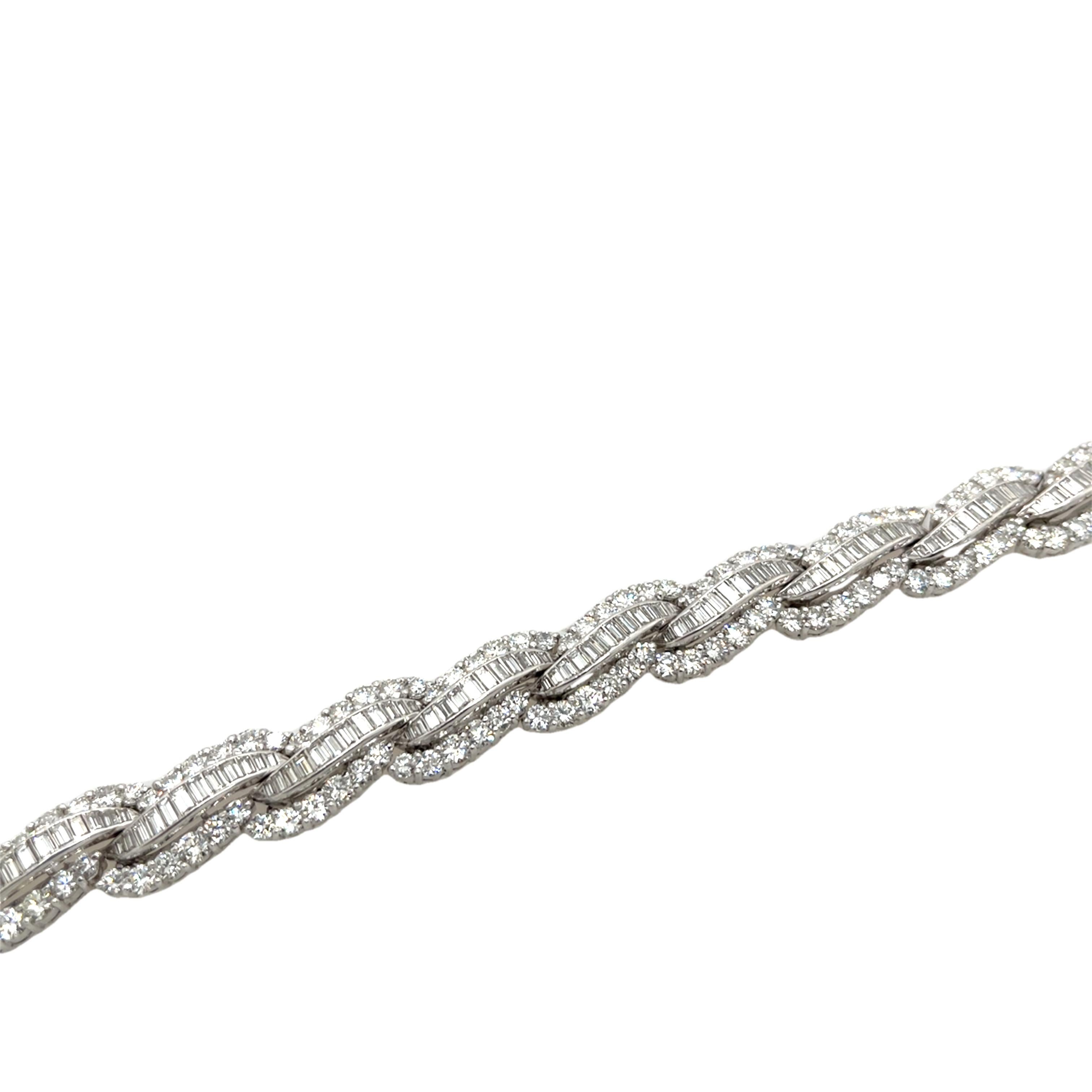 This exquisite 1950-1960' bracelet features an impressive 12.0ct of mixed round and baguette diamonds, set in luxurious platinum. 

The intricate design showcases the elegance and glamour of the Art Deco era, making this bracelet a breathtaking