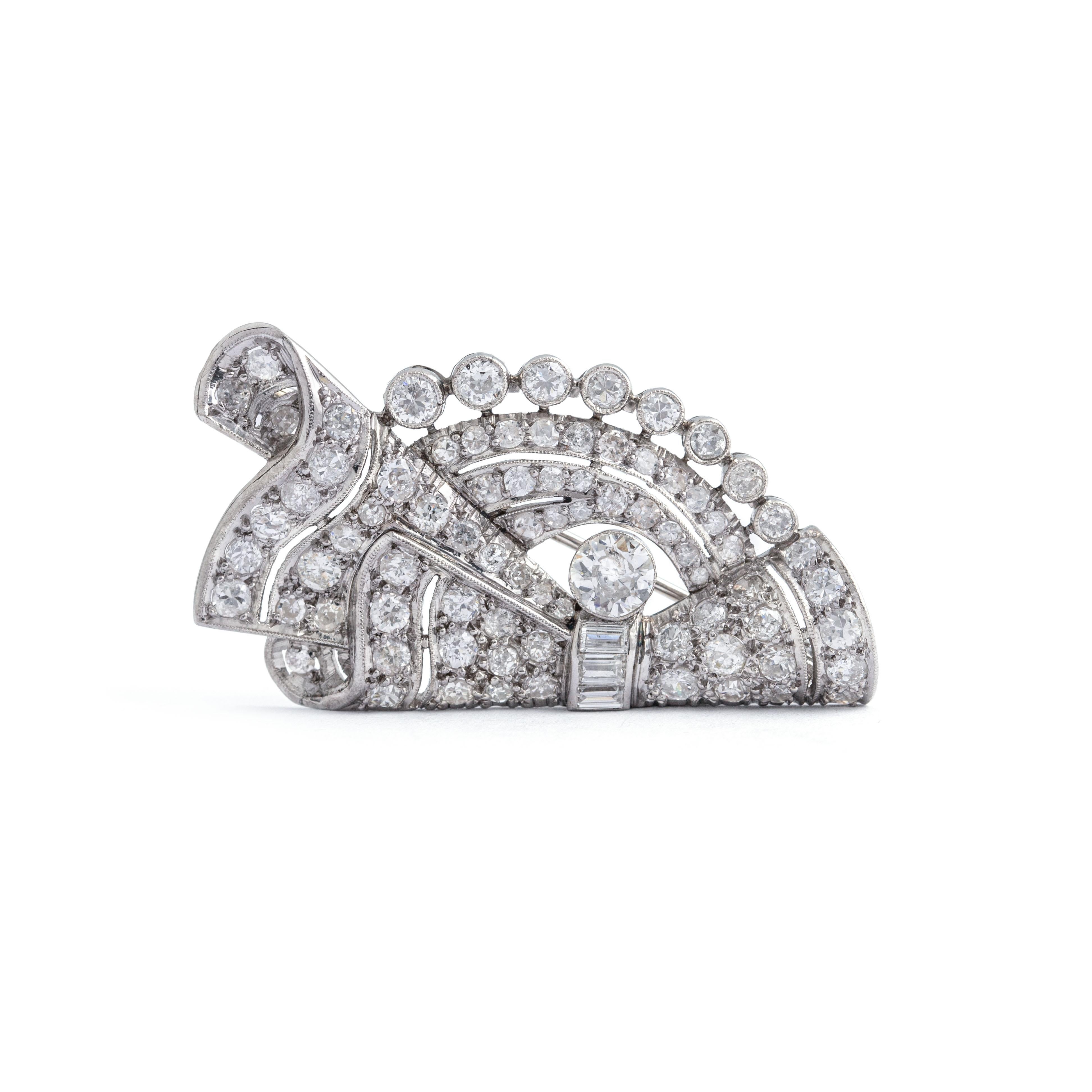 Art Deco Diamond White Gold and Platinum Brooch.
Circa 1950.

Total weight: 15.69 grams.
Dimensions: 
approx. 4.70 centimeters x 2.40 centimeters.
