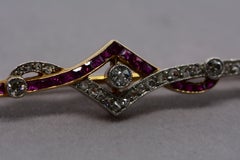 Art Deco Diamond Calibre Cut Ruby Platinum and Yellow Gold Bar Pin